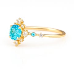 Blue topaz engagement ring in 14 k gold