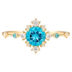 Blue topaz engagement ring in 14 k gold