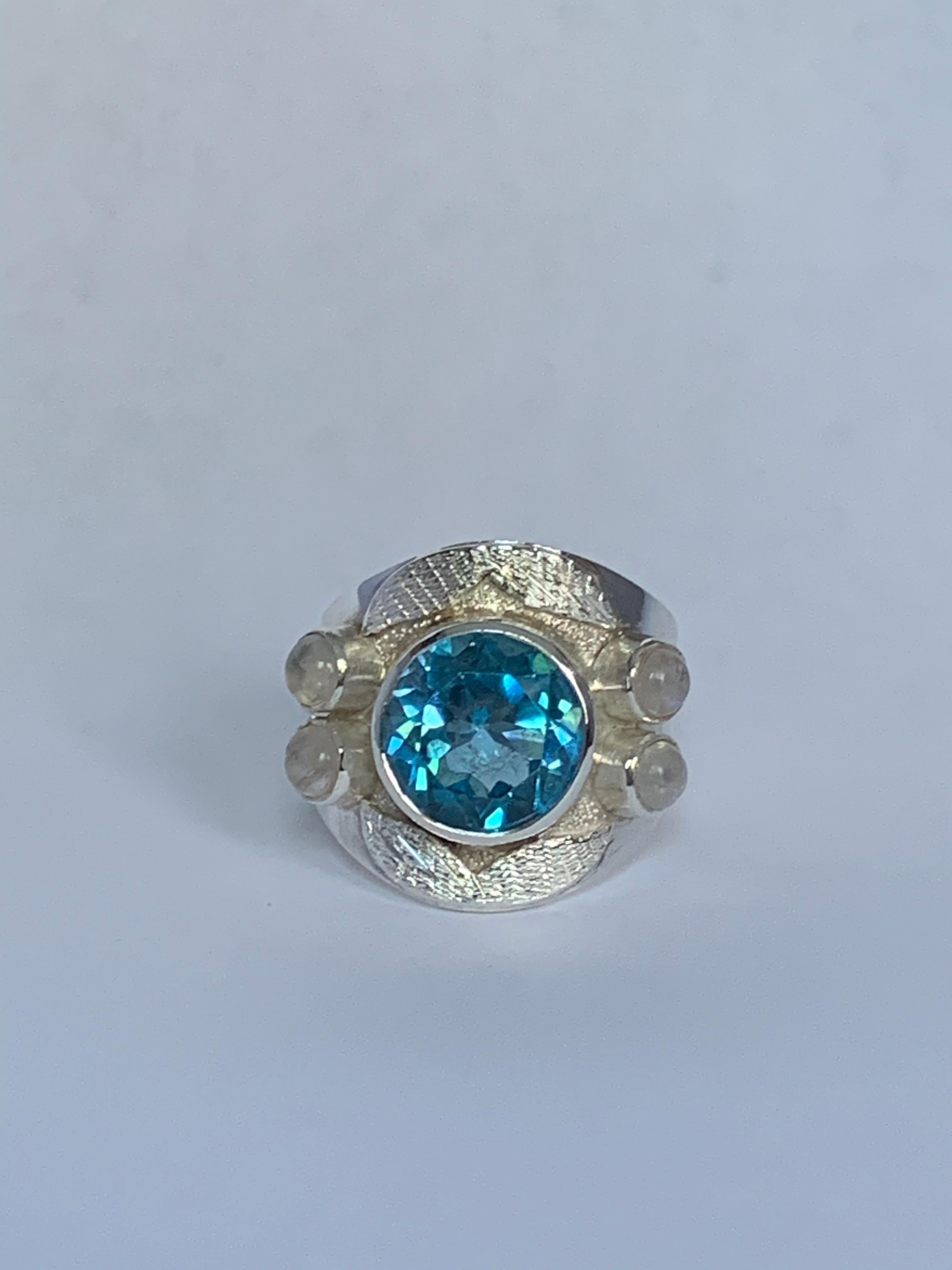 Contemporary Blue Topaz and Moon Stone Ring Set in Sterling Silver For Sale