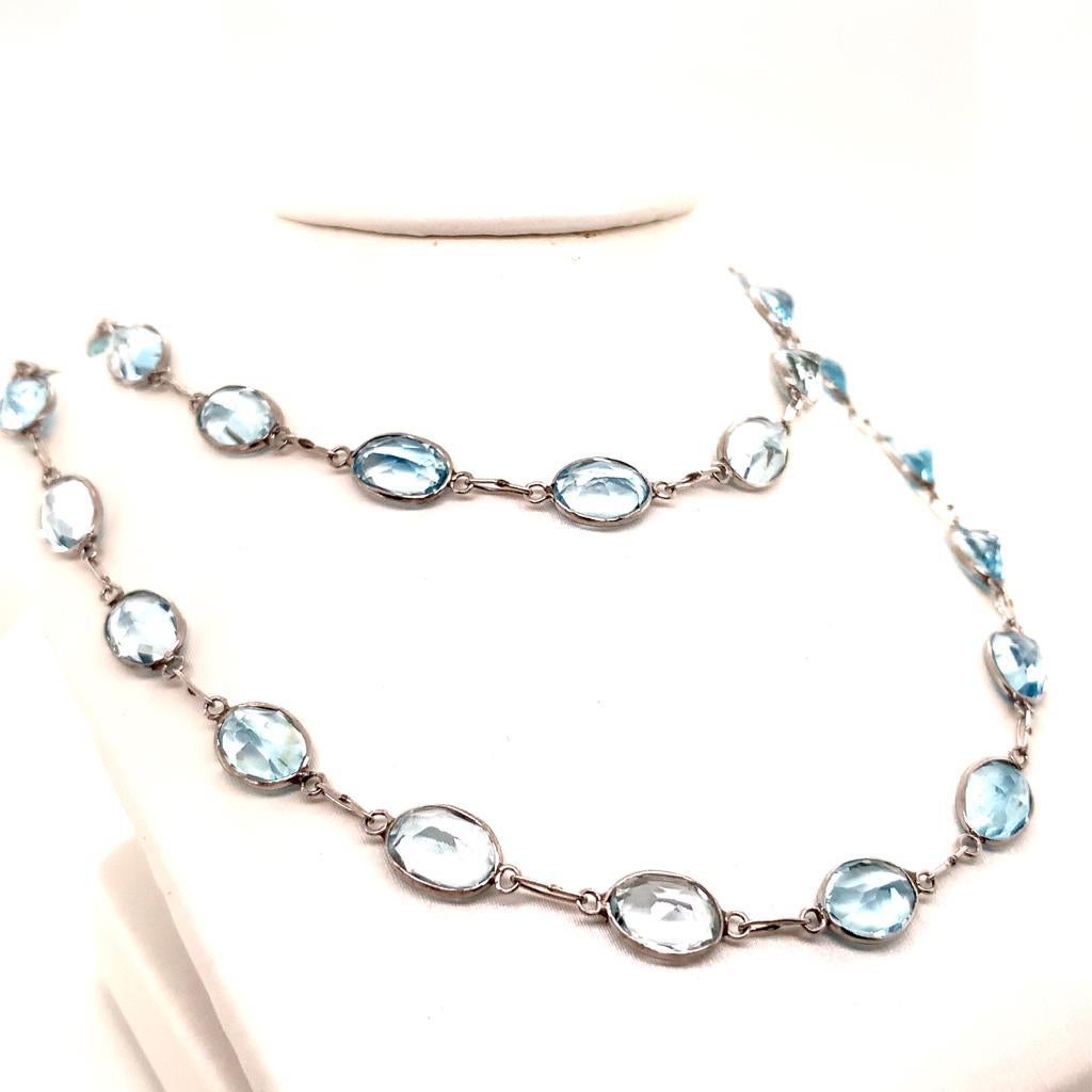 Made of a single strand of 20 inches of breathtakingly beautiful blue topaz set in 18K white gold, this necklace is one that takes the minds of all who see it to a place of calm and contentment. Simple yet elegant, this creation is one that can