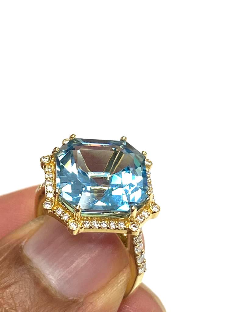  Blue Topaz Octagon Ring with Diamonds in 18k Yellow Gold, from 'Gossip' Collection

Stone Size: 12 X 12 mm

Gemstone Weight: 8.97 Carats

Diamonds: G-H / VS, Approx Wt: 0.37 Carats 