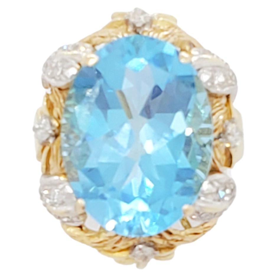 Blue Topaz Oval and Diamond Cocktail Ring in 14k Yellow Gold