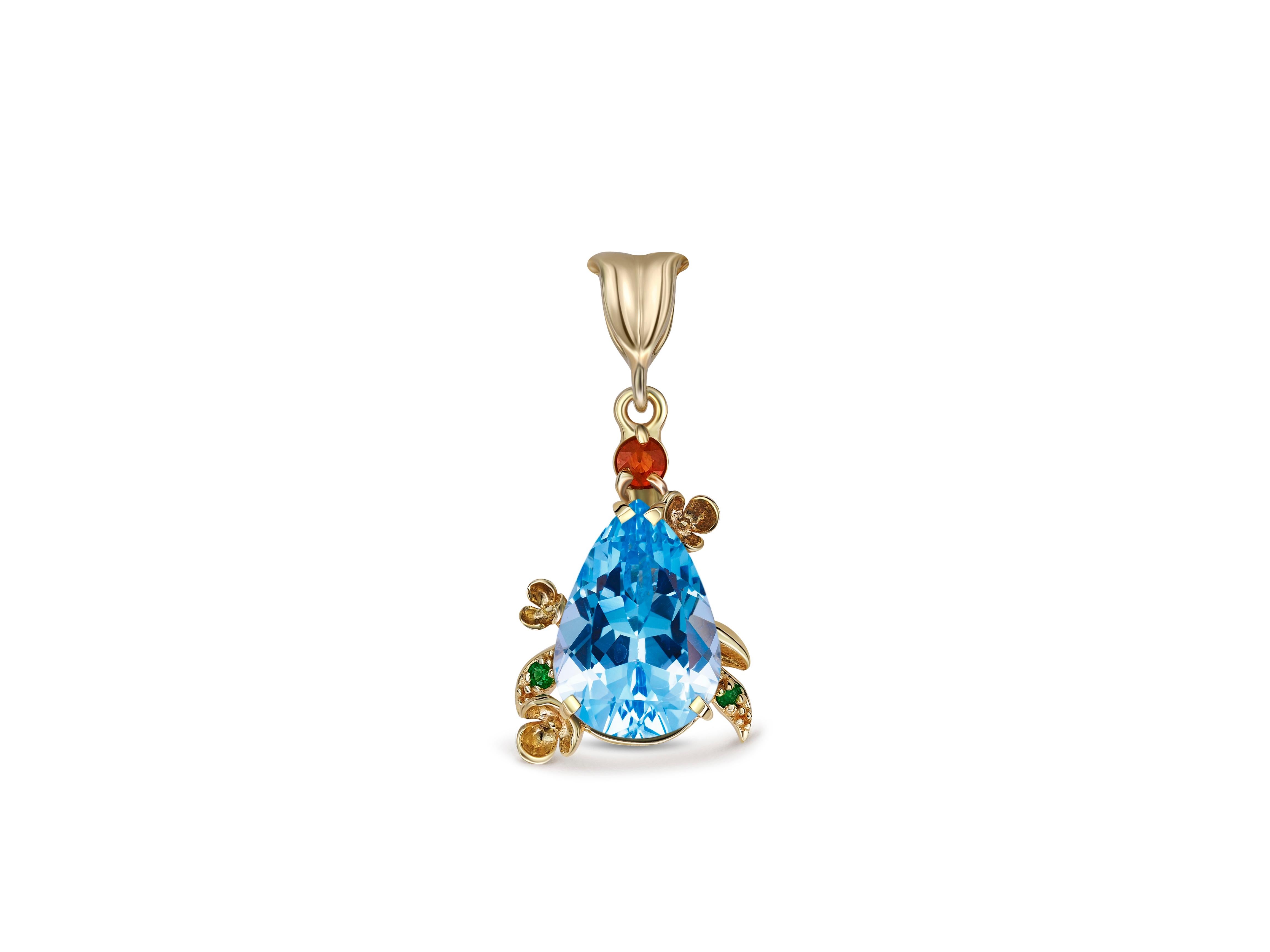 Pear Cut Blue topaz pendant in 14 karat gold.  For Sale
