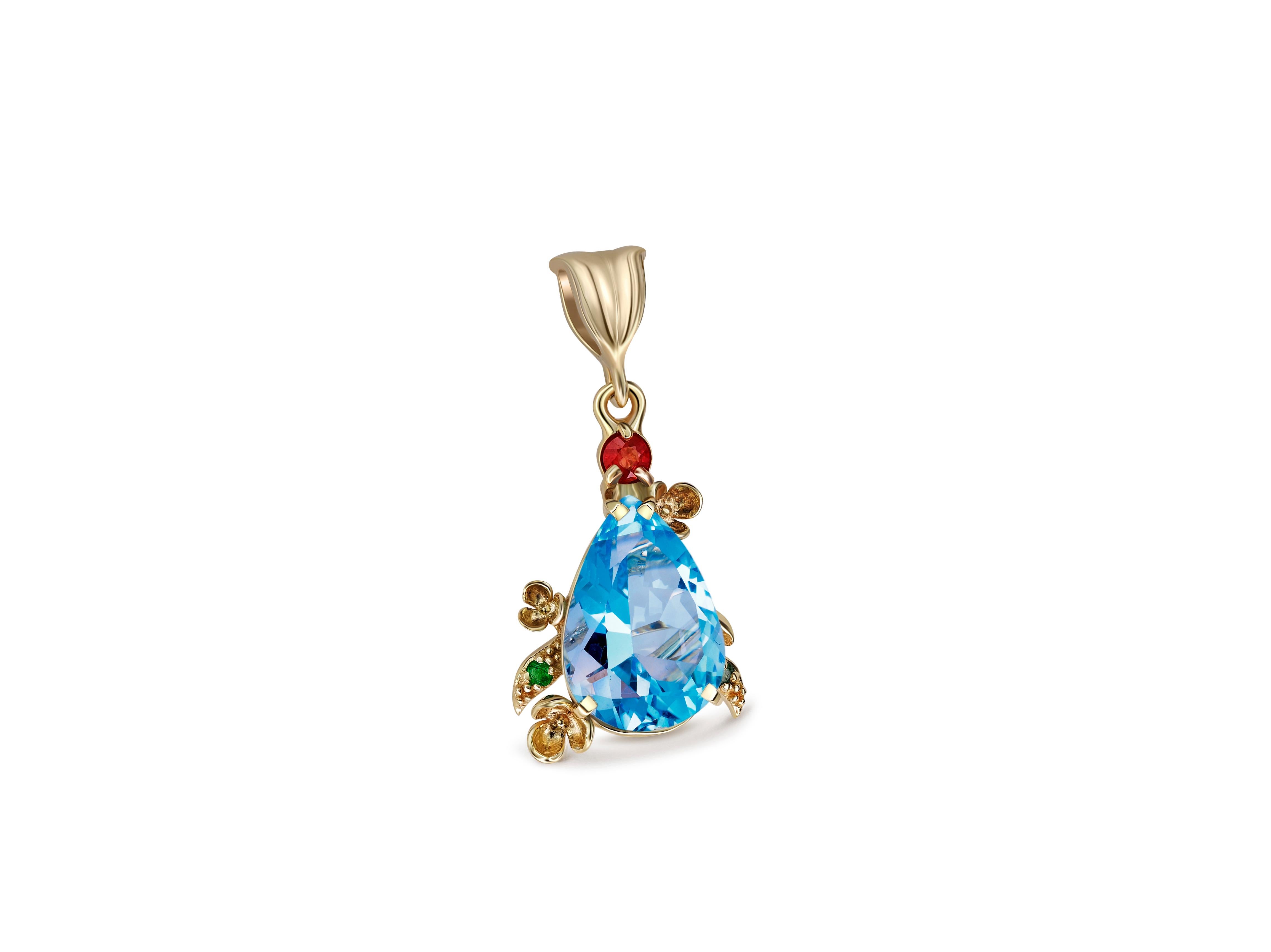 Women's Blue topaz pendant in 14 karat gold.  For Sale