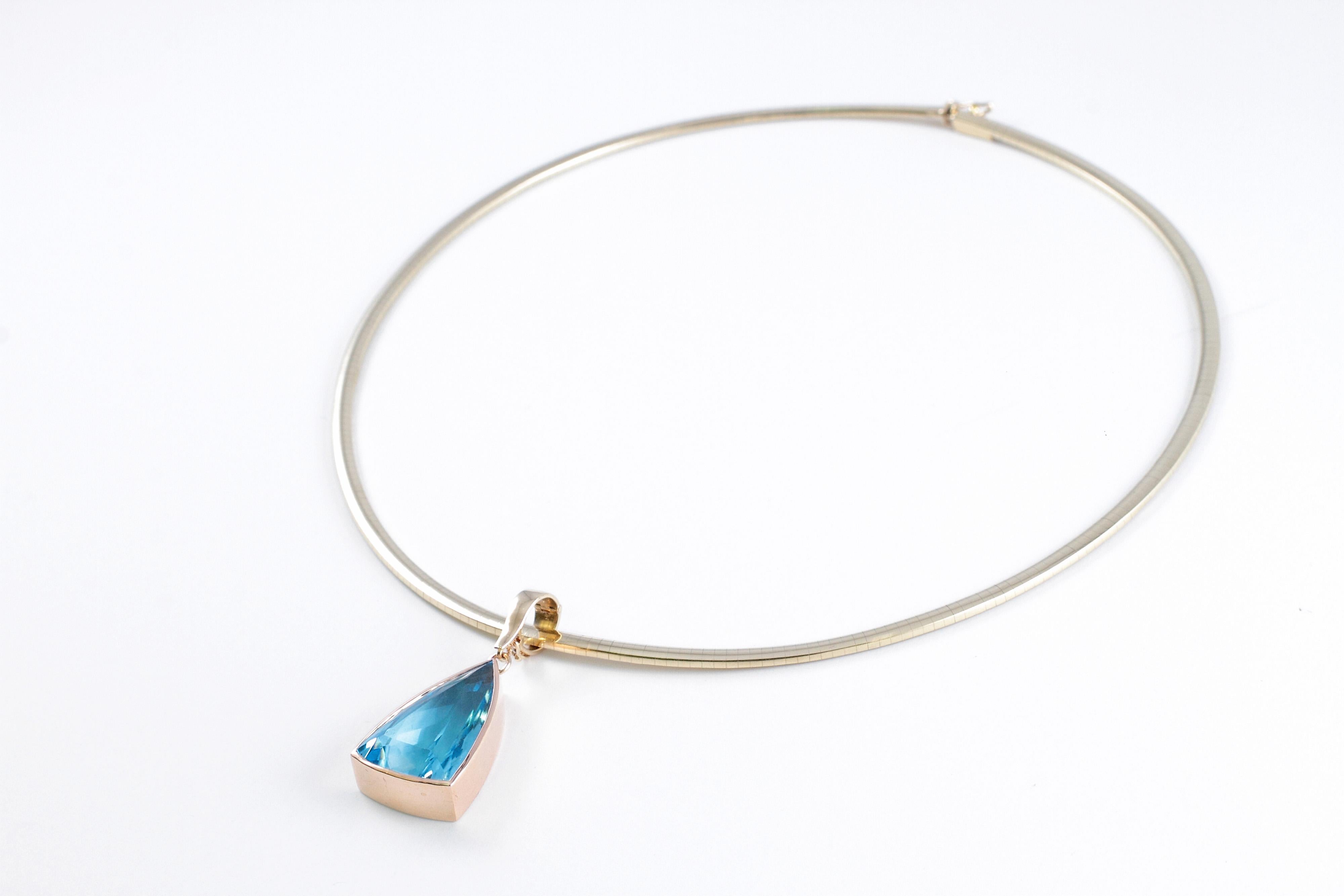 Contemporary Blue Topaz Pendant on 14 Karat Yellow Gold Omega Necklace