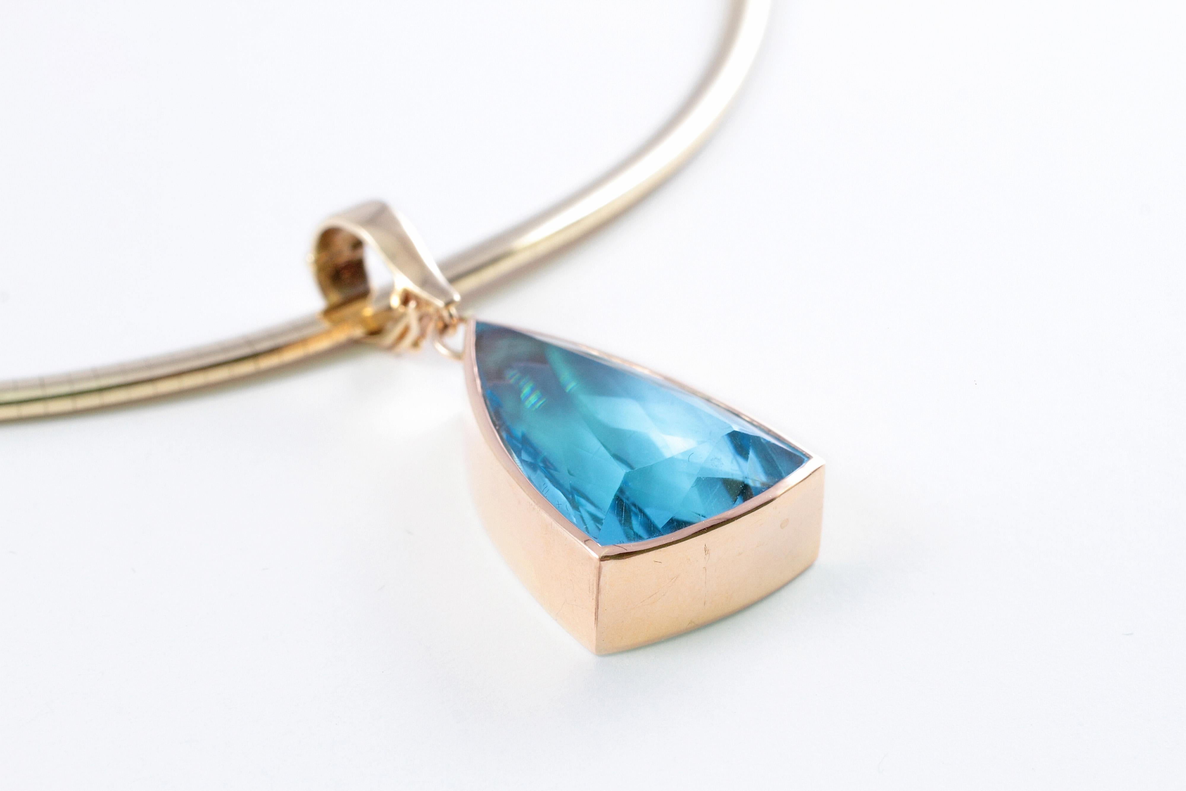 Blue Topaz Pendant on 14 Karat Yellow Gold Omega Necklace In Good Condition In Dallas, TX