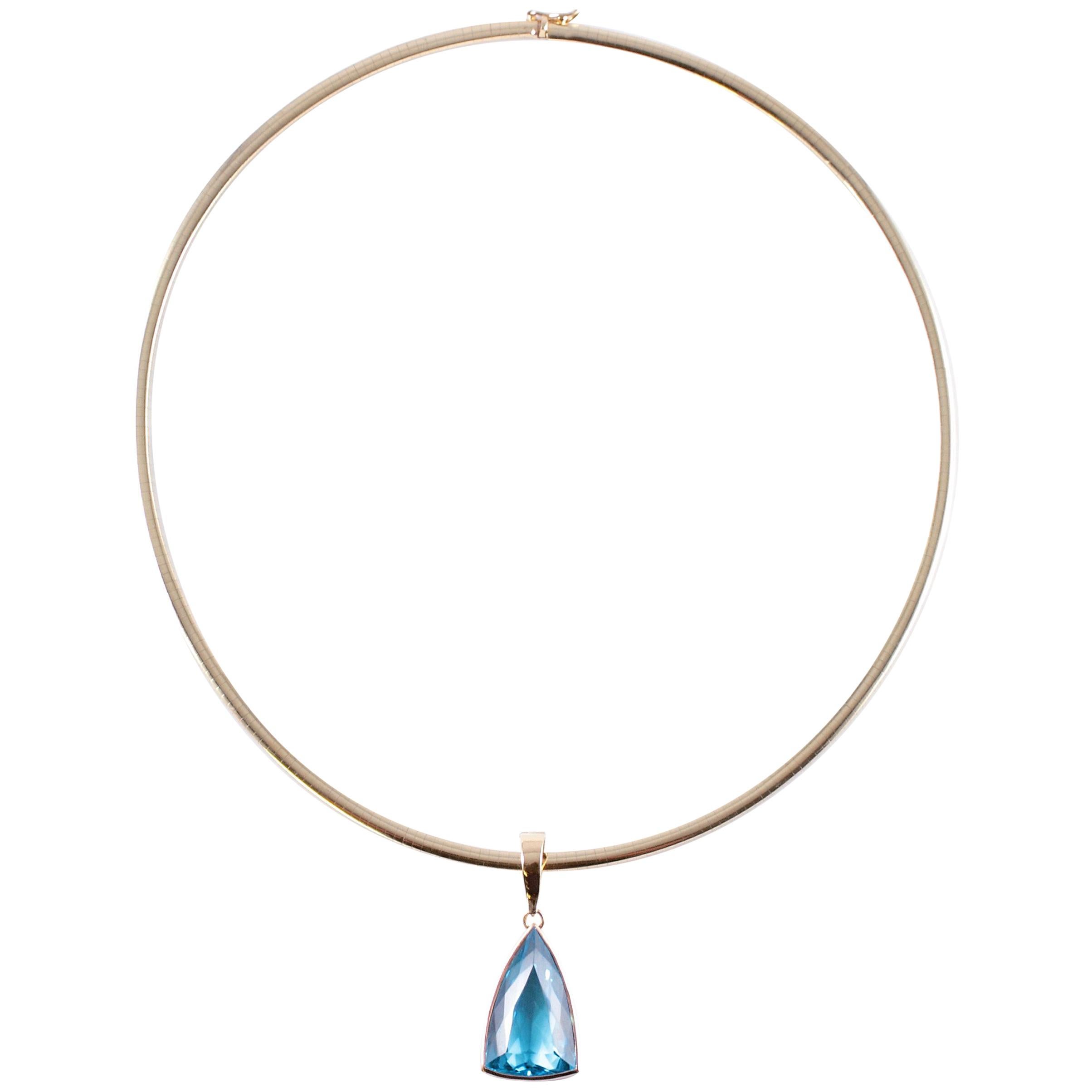 Blue Topaz Pendant on 14 Karat Yellow Gold Omega Necklace