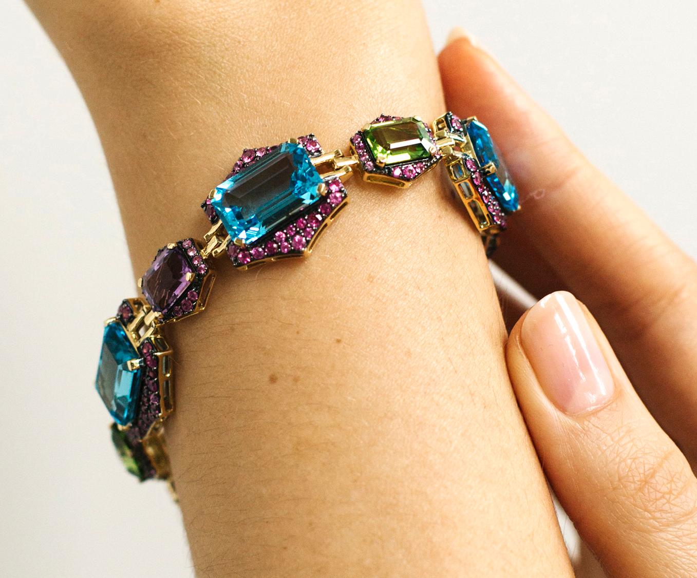 Blue Topaz, Peridot & Amethyst Bracelet with Pink Sapphires in 18K Yellow Gold, from 'Rain-Forest' Collection. Please allow 2-4 weeks for this item to be delivered.

Bracelet Length: 7 1/2