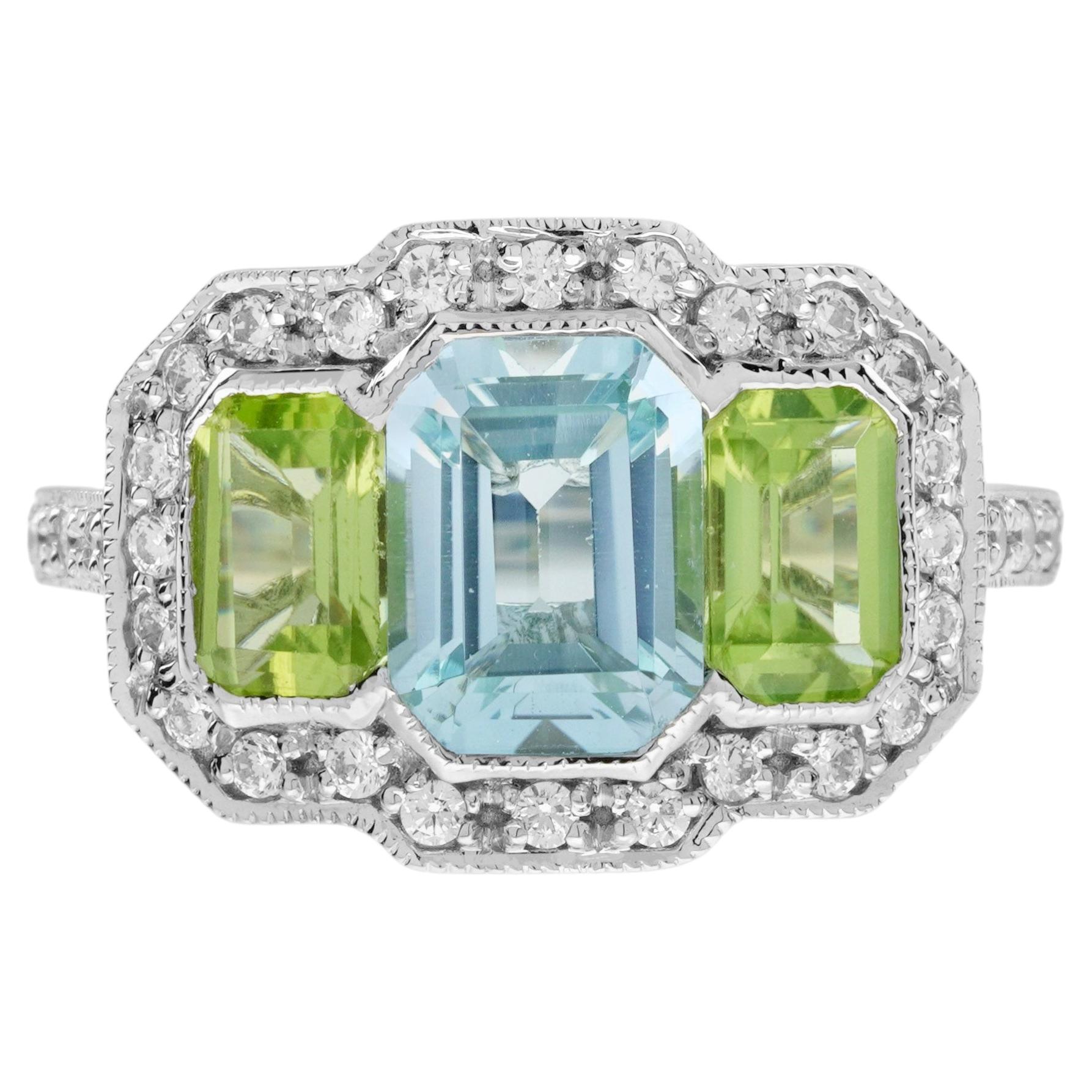 Anello a tre pietre in stile Art Deco con peridoto e topazio blu e diamante in oro bianco 14 carati