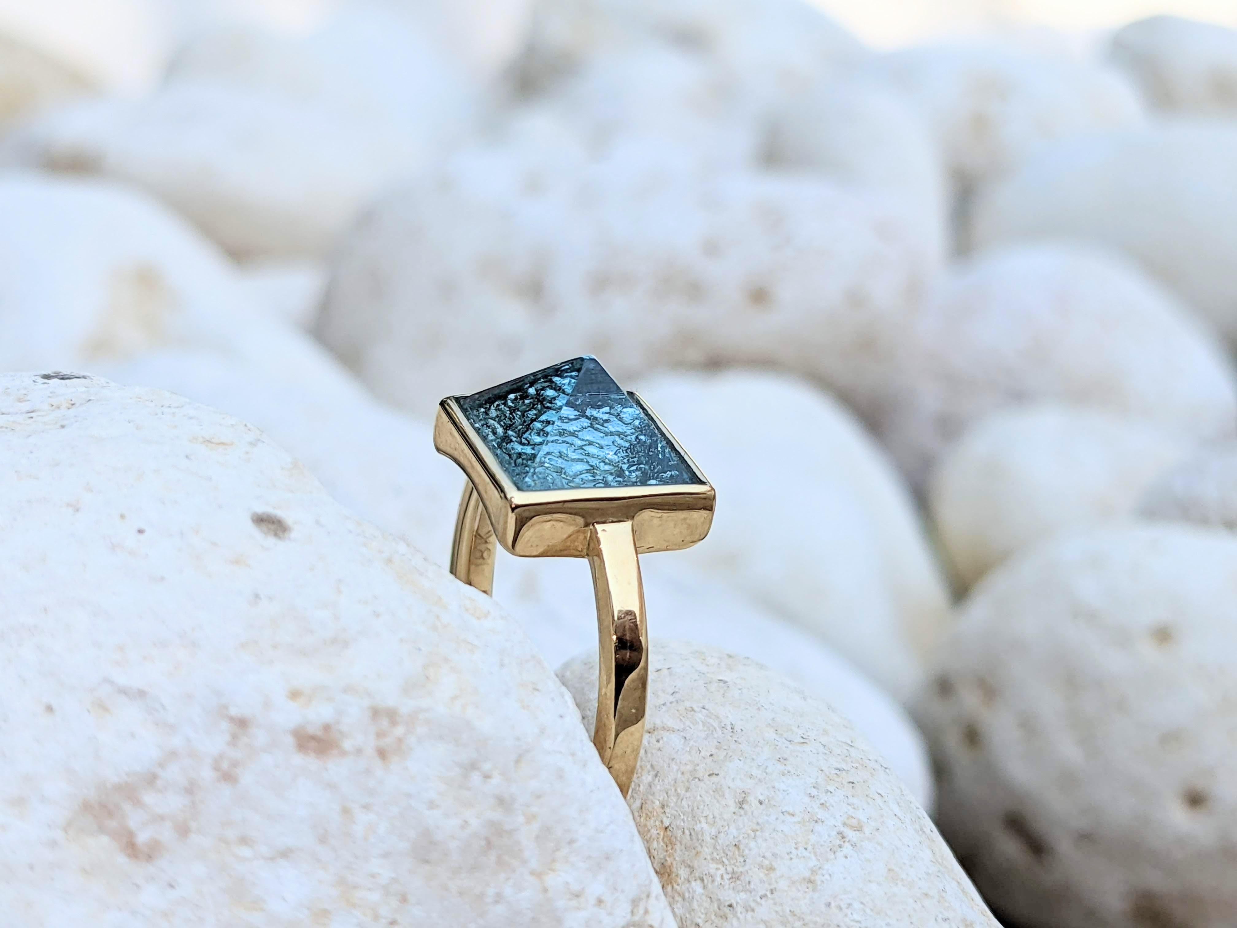 Blue Topaz Pyramid 18k yellow gold ring 

Encapsule the gorgeous turquoise waters with the Energy of the Pyramidal shape 

Ring size 6 adjustable upon request