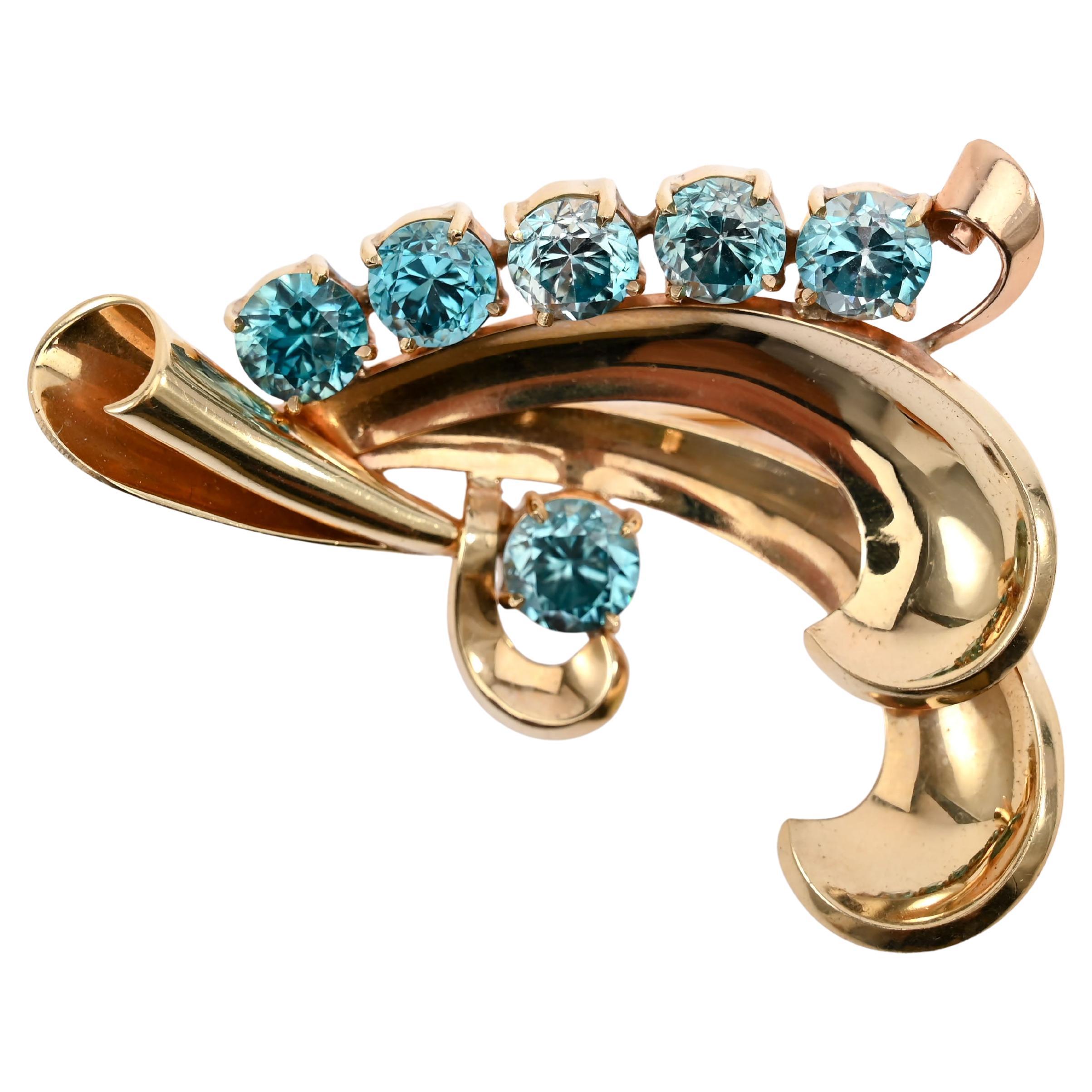 Spilla d
oro retrò in topazio blu