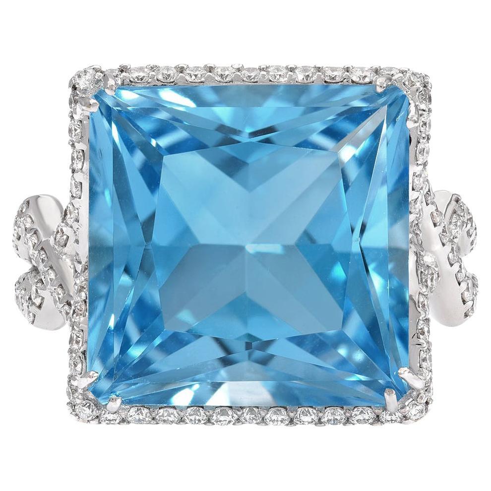 Impressive 14.66 carat princess cut Blue Topaz, 18K white gold ring, decorated with a total of 0.97 carat round brilliant diamonds.
Size 6. Re-sizing is complementary upon request  
Returns are accepted and paid by us within 7 days of