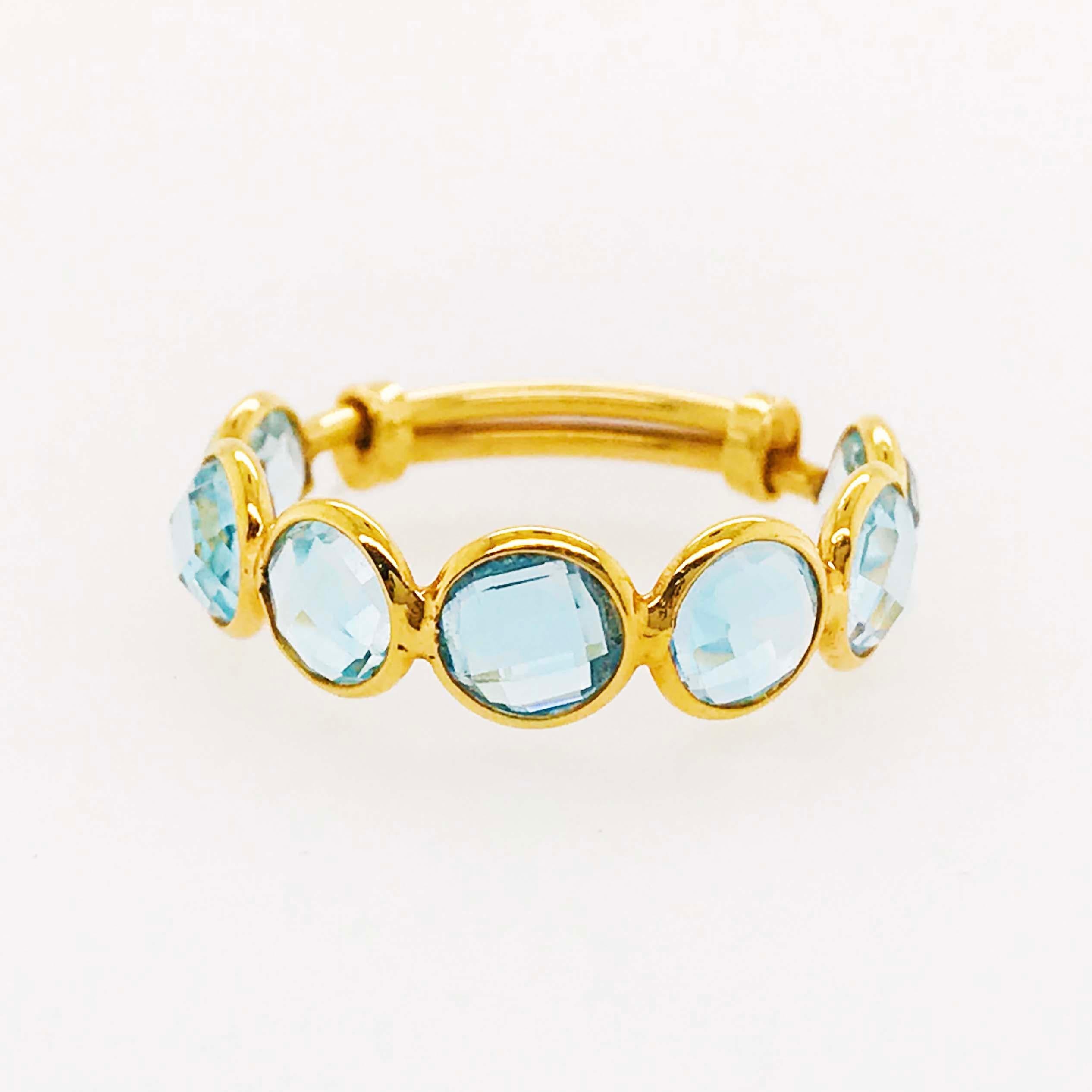 This unique, fun blue topaz ring is creative and innovative! With an adjustable band design this ring can fit almost any finger for different looks and jewelry pairing designs! The adjustable ring has genuine, nature blue topaz gemstones that have