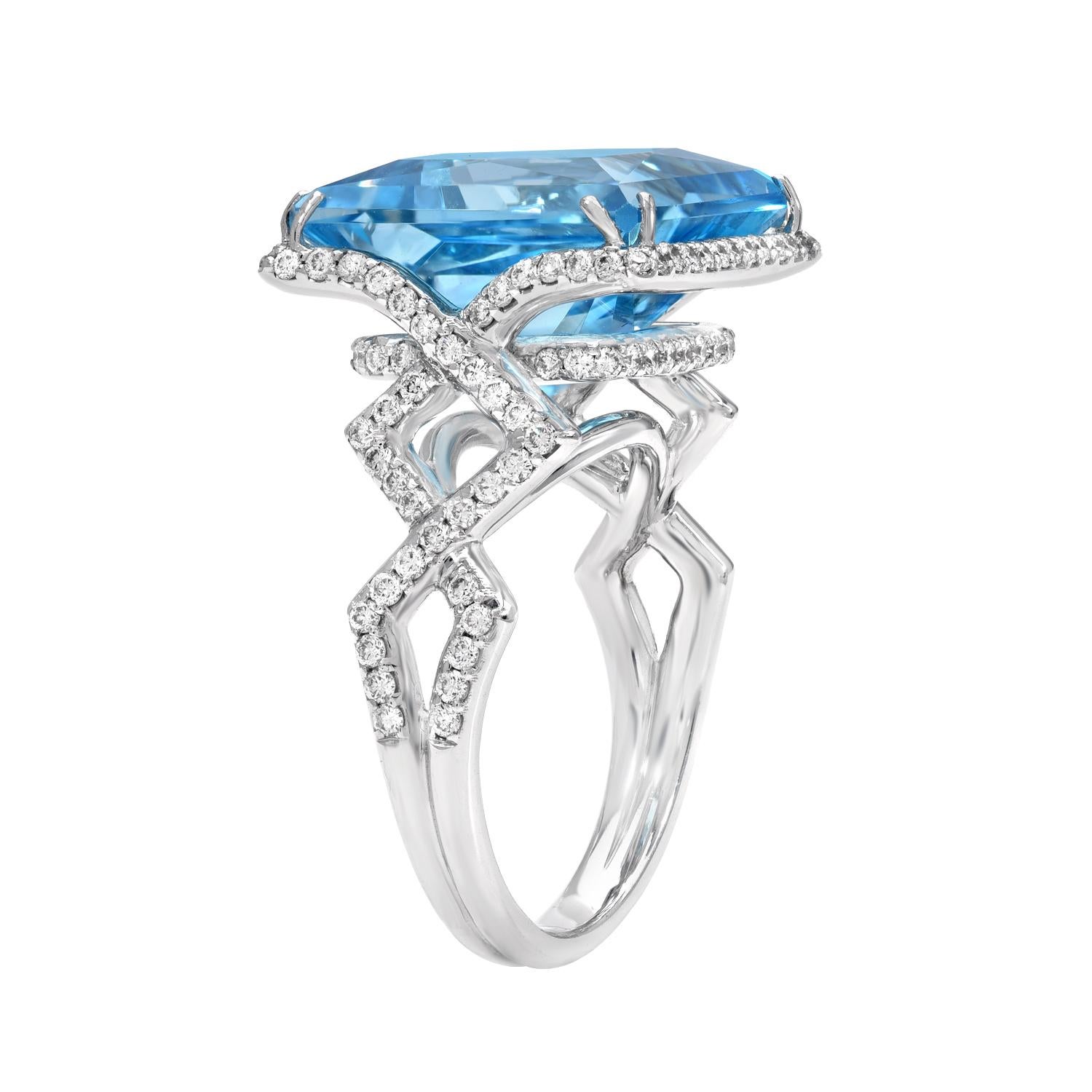 White gold diamond ring featuring a vibrant 14.66 carat princess cut Blue Topaz, adorned by a total of 0.97 carat round brilliant diamonds.
Crafted in 18K white gold.
Size 7. Re-sizing is complementary upon request  
Returns are accepted and paid by