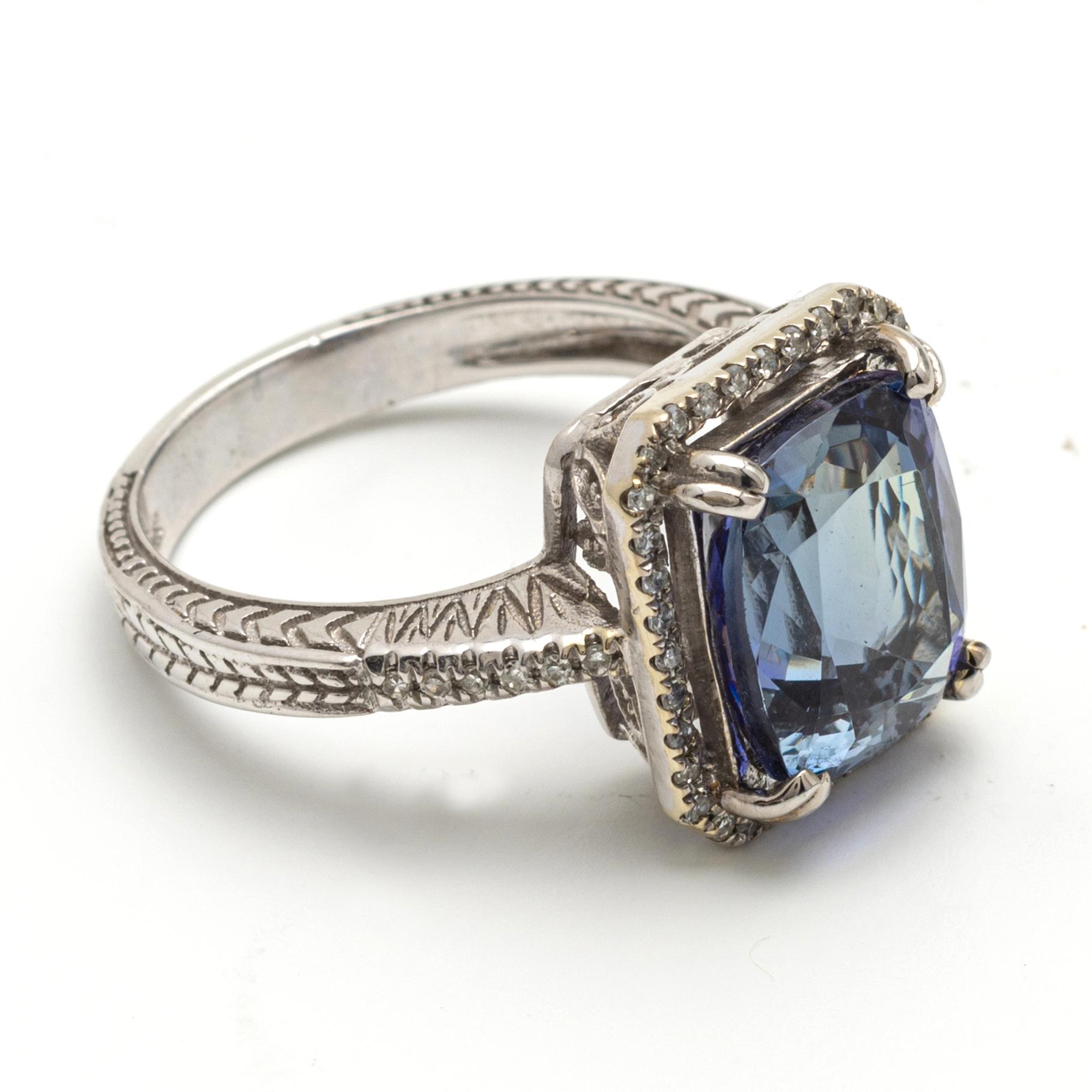 Blue Topaz Ring, claw set with an emerald-cut blue topaz, measuring approximately 8.1 x 10.1 mm, mounted in 14 karat white gold, size 6