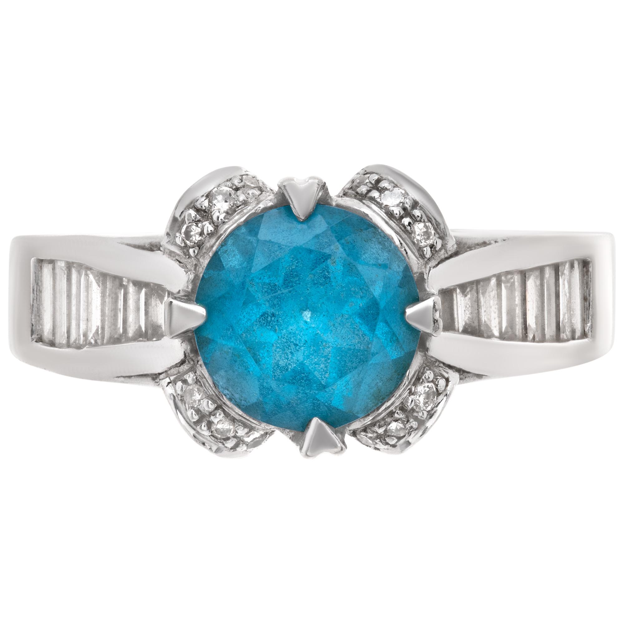 Round brilliant cut blue topaz (1.71 carat) & diamonds ring set in 14k white gold. Round & baguette cut diamonds total approx. weight: 0.66 carats. All diamonds are white and eye clean. 8 x 8mm. Size 5.5This Topaz ring is currently size 5.5 and some