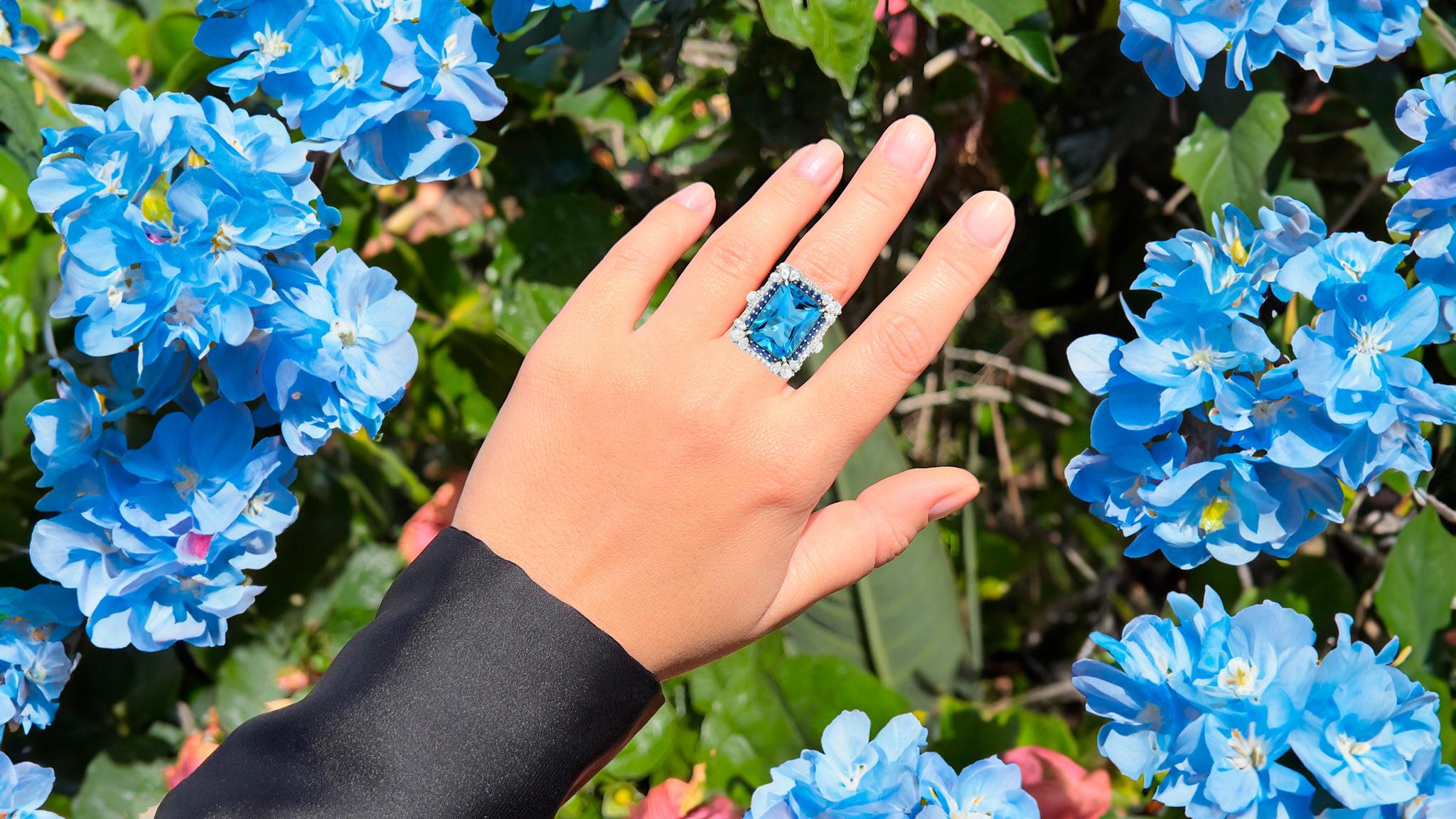It comes with the Gemological Appraisal by GIA GG/AJP
All Gemstones are Natural
Blue Topaz = 10.97 Carat
Sapphires = 1.85 Carat
Diamonds = 0.32 Carats
Metal: 18K White Gold
Ring Size: 7* US
*It can be resized complimentary
