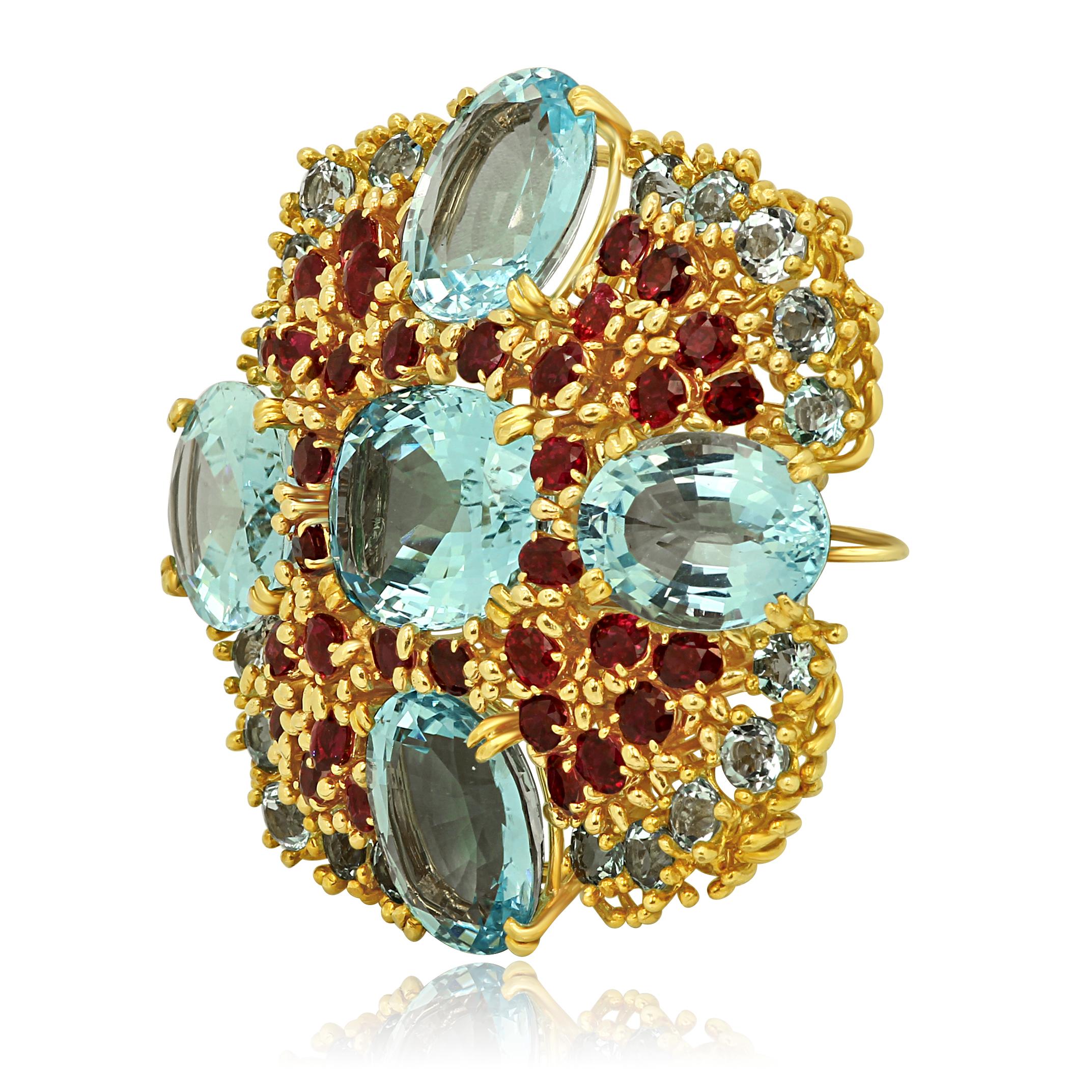 Stunning Blue Topaz Round and Oval Approximately 100 Carats With Ruby ovals Approximately 15 Carats in 18K Yellow Gold Handmade One of a kind Brooch Pendant.

Total Stone Weight Approximately 115 Carats.