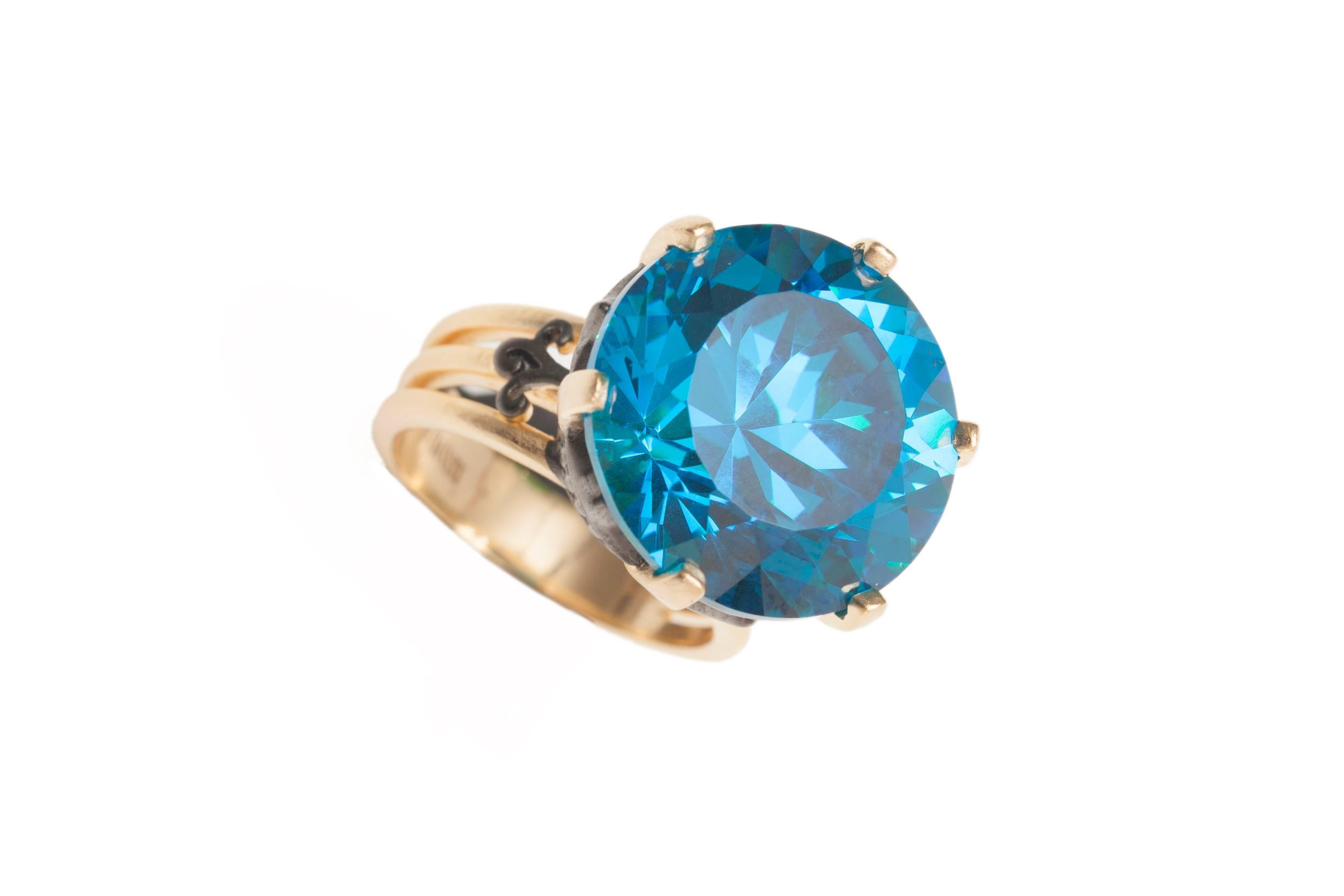 Blue topaz a symbol of love and affection; an18mm hand cut on vermeil gold and black ruthenium ring. Our Sa'mma statement ring is masterfully crafted to reflect elegance and class!
Size (6, 7,8) Special size per request