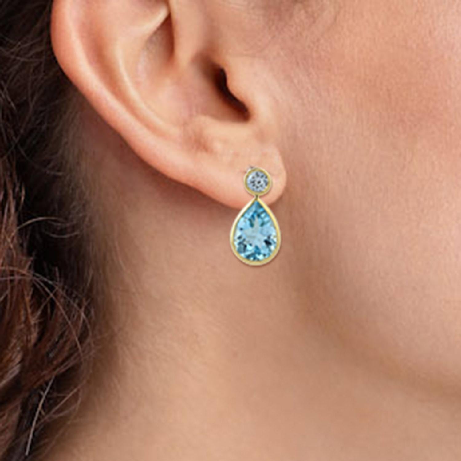 Cast from 18-karat gold.  These beautiful earrings are hand set with 4.76 carats blue topaz & .41 carats sapphire.  

FOLLOW  MEGHNA JEWELS storefront to view the latest collection & exclusive pieces.  Meghna Jewels is proudly rated as a Top Seller