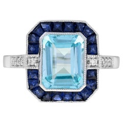 Anello con zaffiro blu e diamante in oro bianco 14K