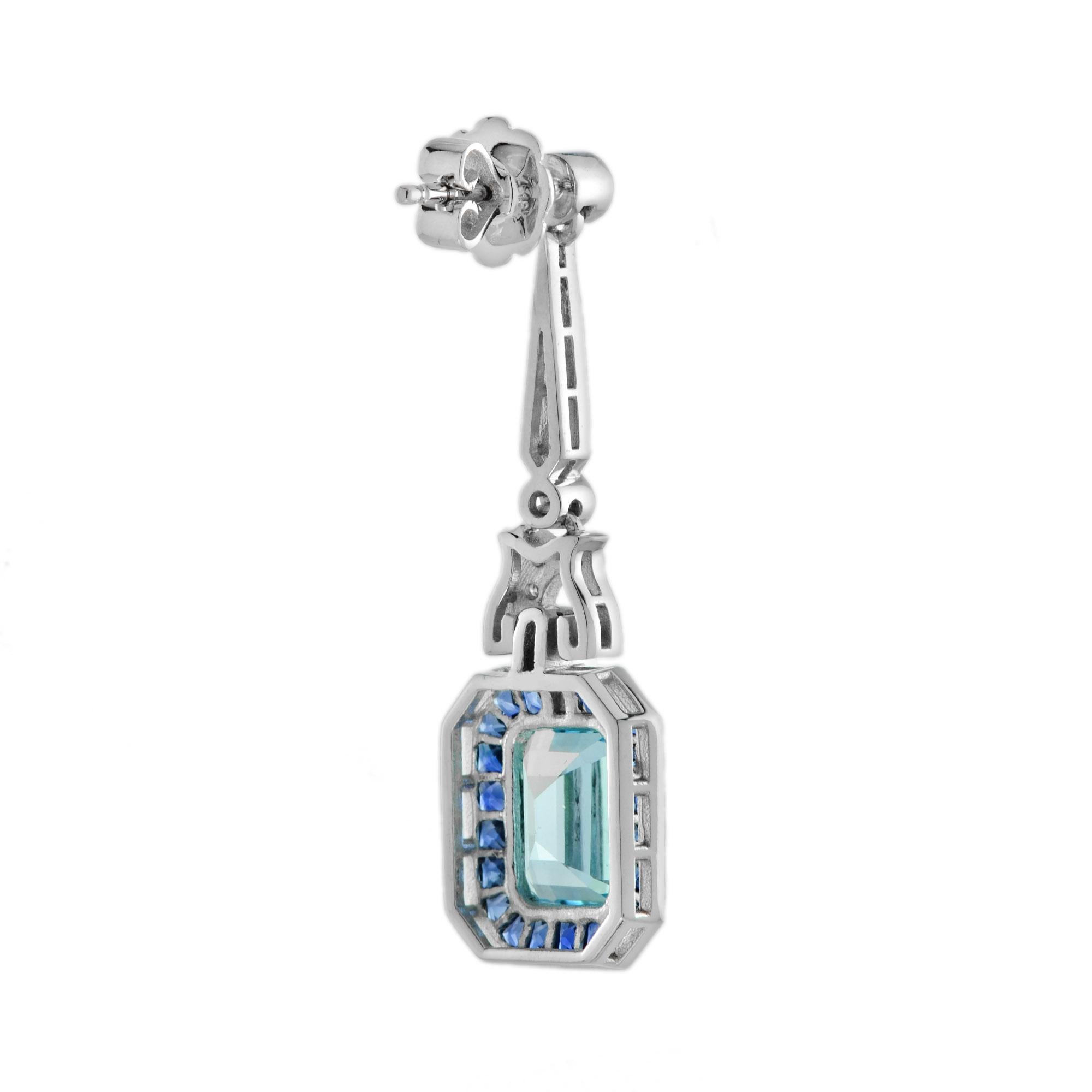 Art déco Boucles d'oreilles pendantes en or blanc 14 carats Topaze bleue et saphir Diamant de style Art Déco en vente