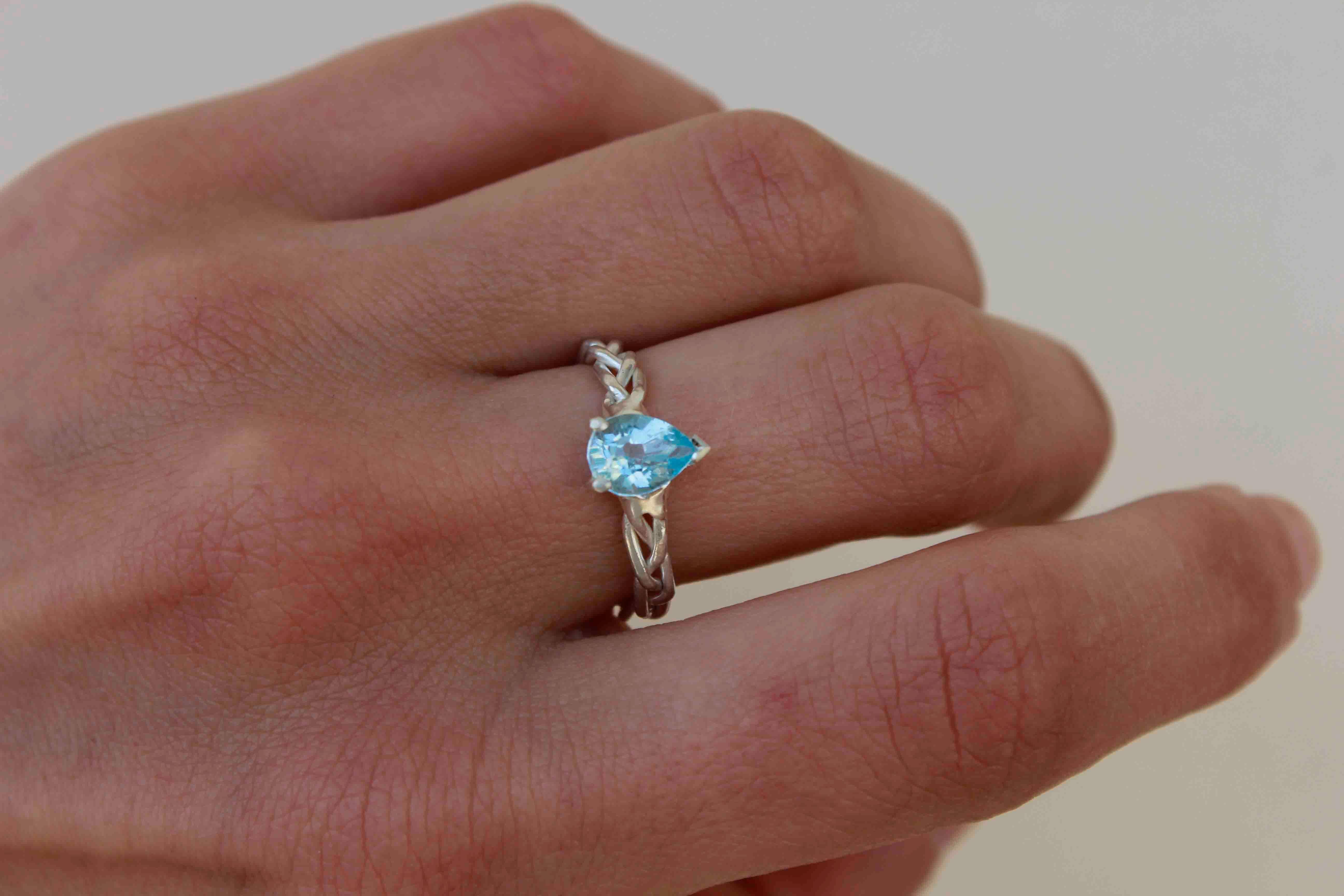 Blue Topaz Silver Ring

A romantic, yet statement ring featuring a blue topaz pear stone.

A lovely sea-blue stone, with a unique handmade braided band.

Stone size 6×8 mm

Your ring will be made to order in your size, so please leave me your size