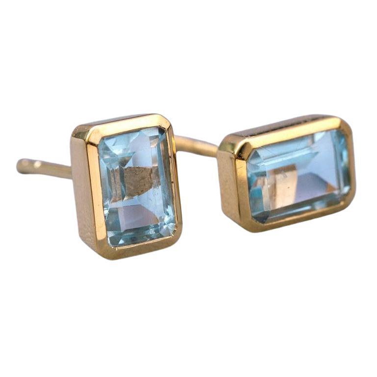 Blue Topaz Stud Earrings 14K Yellow Gold Emerald Cut For Sale