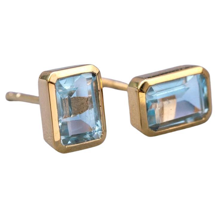 Blue Topaz Stud Earrings 18K Yellow Gold Emerald Cut For Sale