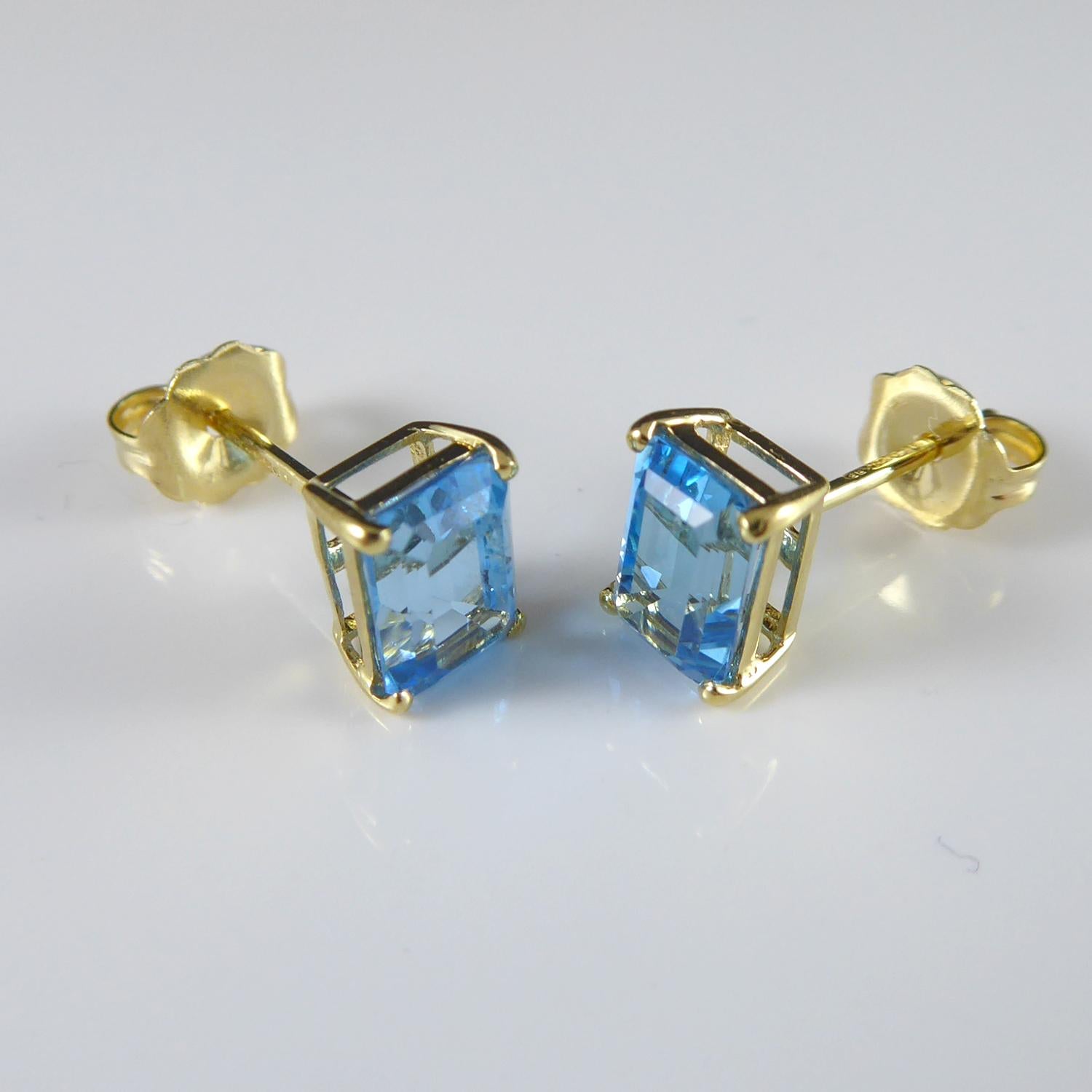 Modern Blue Topaz Stud Earrings in Yellow Gold