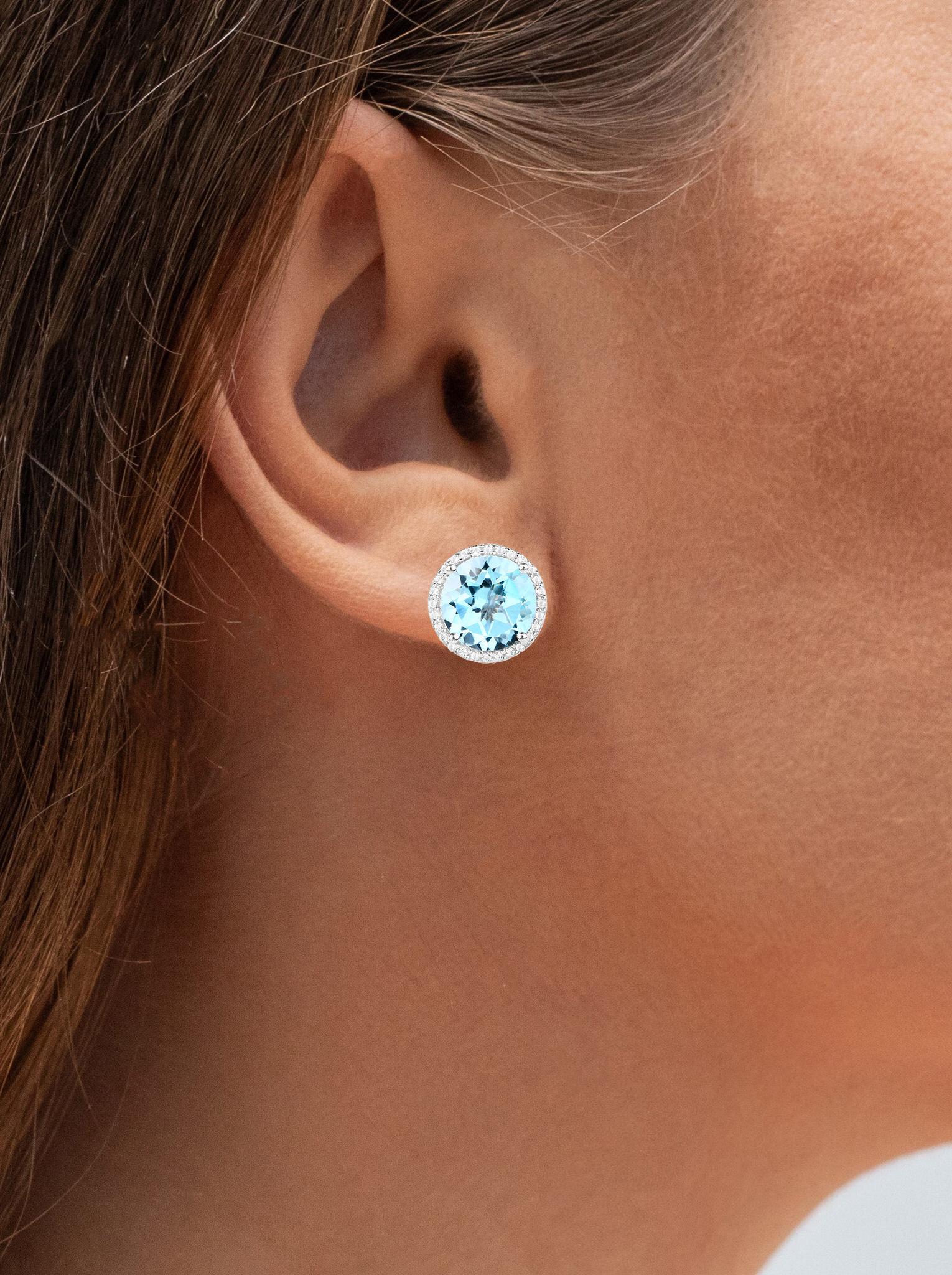 Contemporary Blue Topaz Stud Earrings White Topaz Halo 7.7 Carats Rhodium Plated Silver For Sale