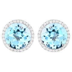 Clous d'oreilles en argent rhodié avec topaze bleue et halo de topaze blanche de 7,7 carats