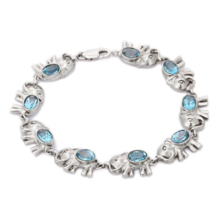 Beautifully handcrafted Blue Topaz Elephant Charm Bracelet, designed with love, including handpicked luxury gemstones for each designer piece. Grab the spotlight with this exquisitely crafted piece. Inlaid with natural blue topaz gemstones, this