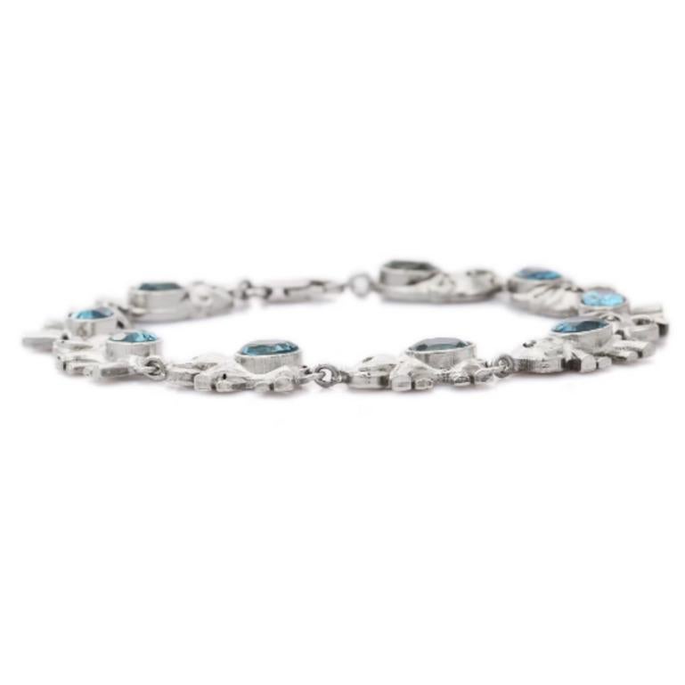 Contemporary Blue Topaz Studded Sterling Silver Elephant Bracelet for Women For Sale