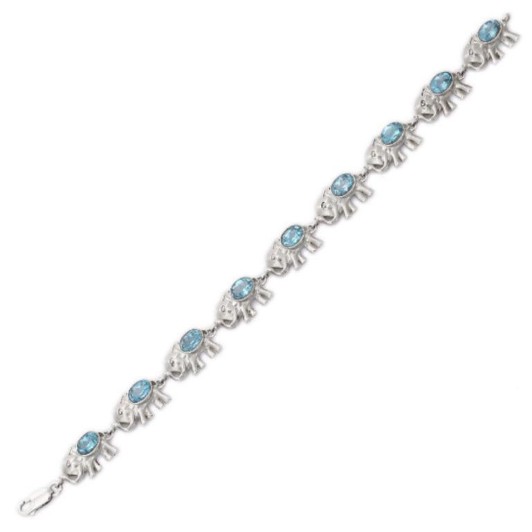 Oval Cut Blue Topaz Studded Sterling Silver Elephant Bracelet for Women For Sale