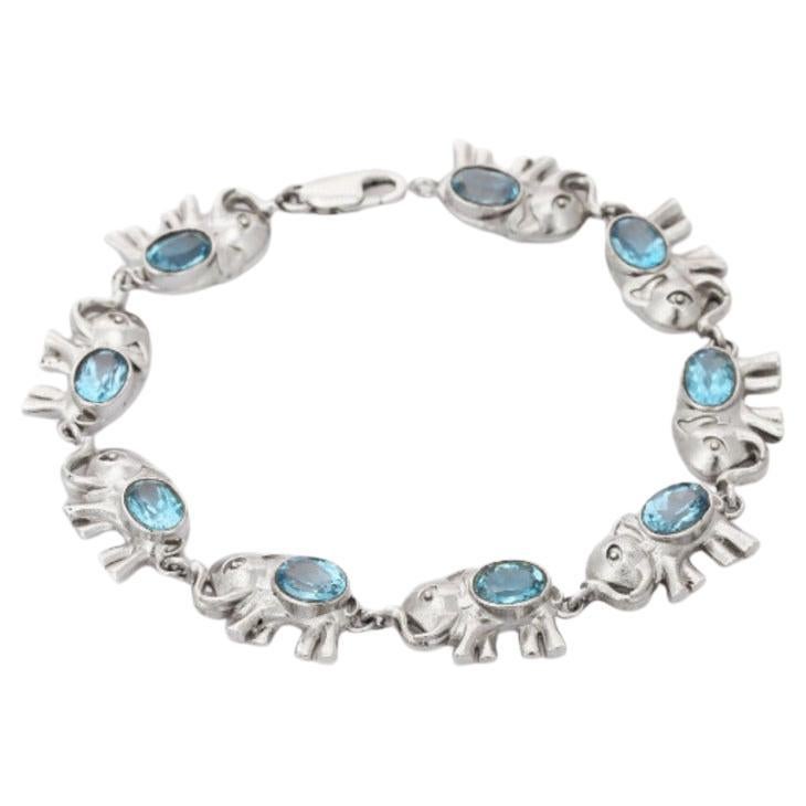 Blue Topaz Studded Sterling Silver Elephant Bracelet for Women For Sale