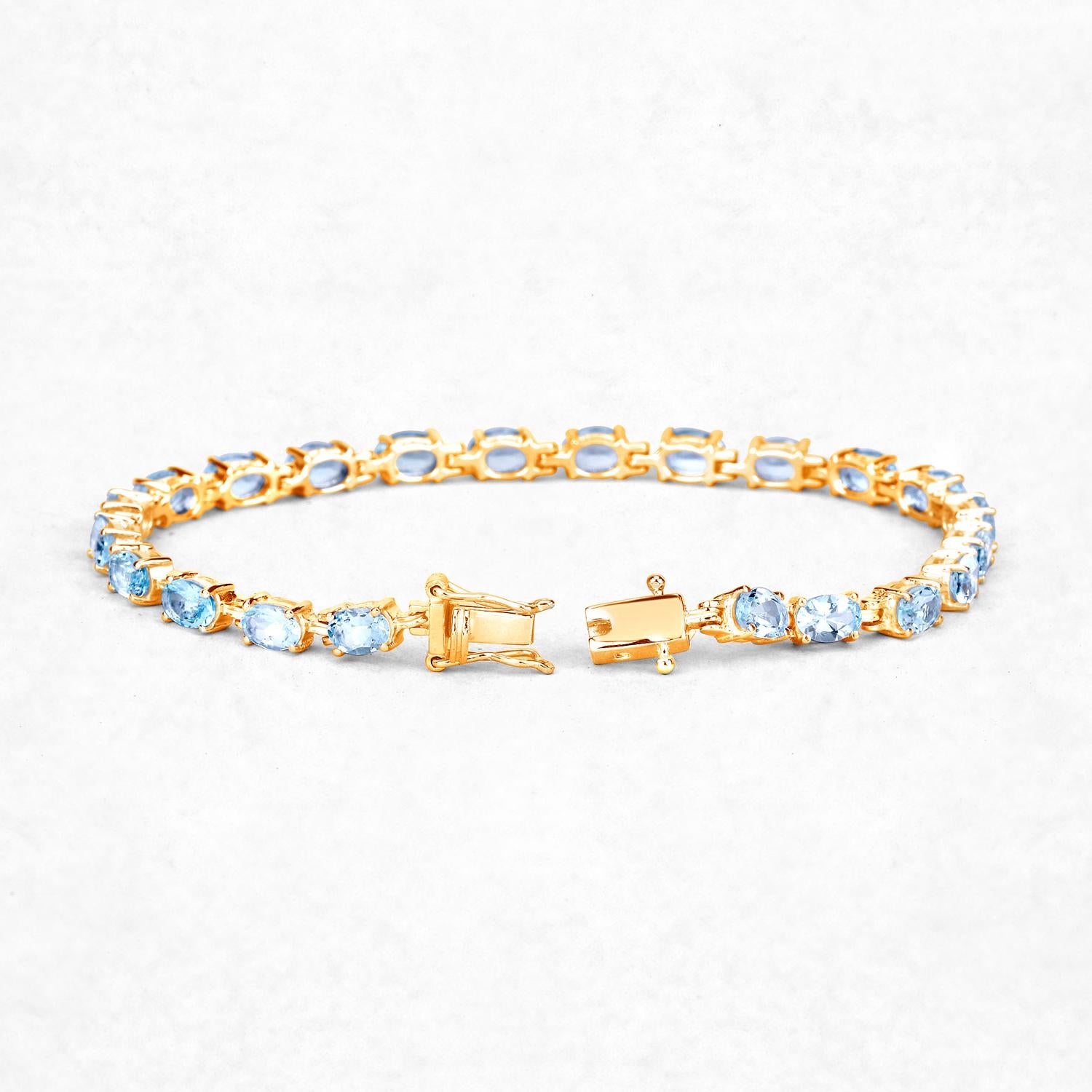 Blue Topaz Tennis Bracelet 11.2 Carats 14K Yellow Gold Plated Silver In Excellent Condition For Sale In Aliso Viejo, CA