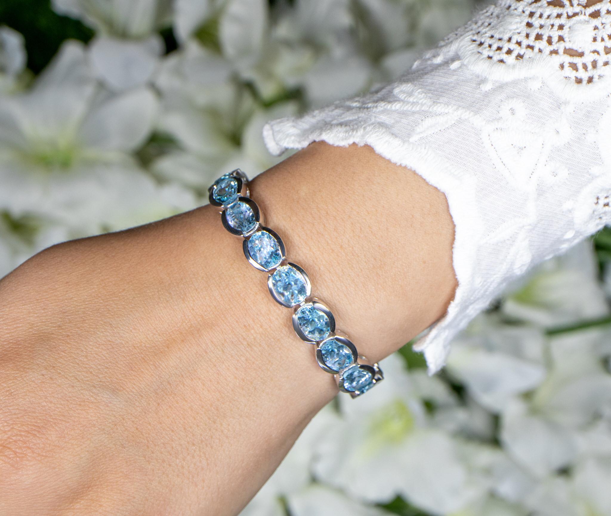 Contemporary Blue Topaz Tennis Bracelet 43.6 Carats Rhodium Plated Sterling Silver For Sale