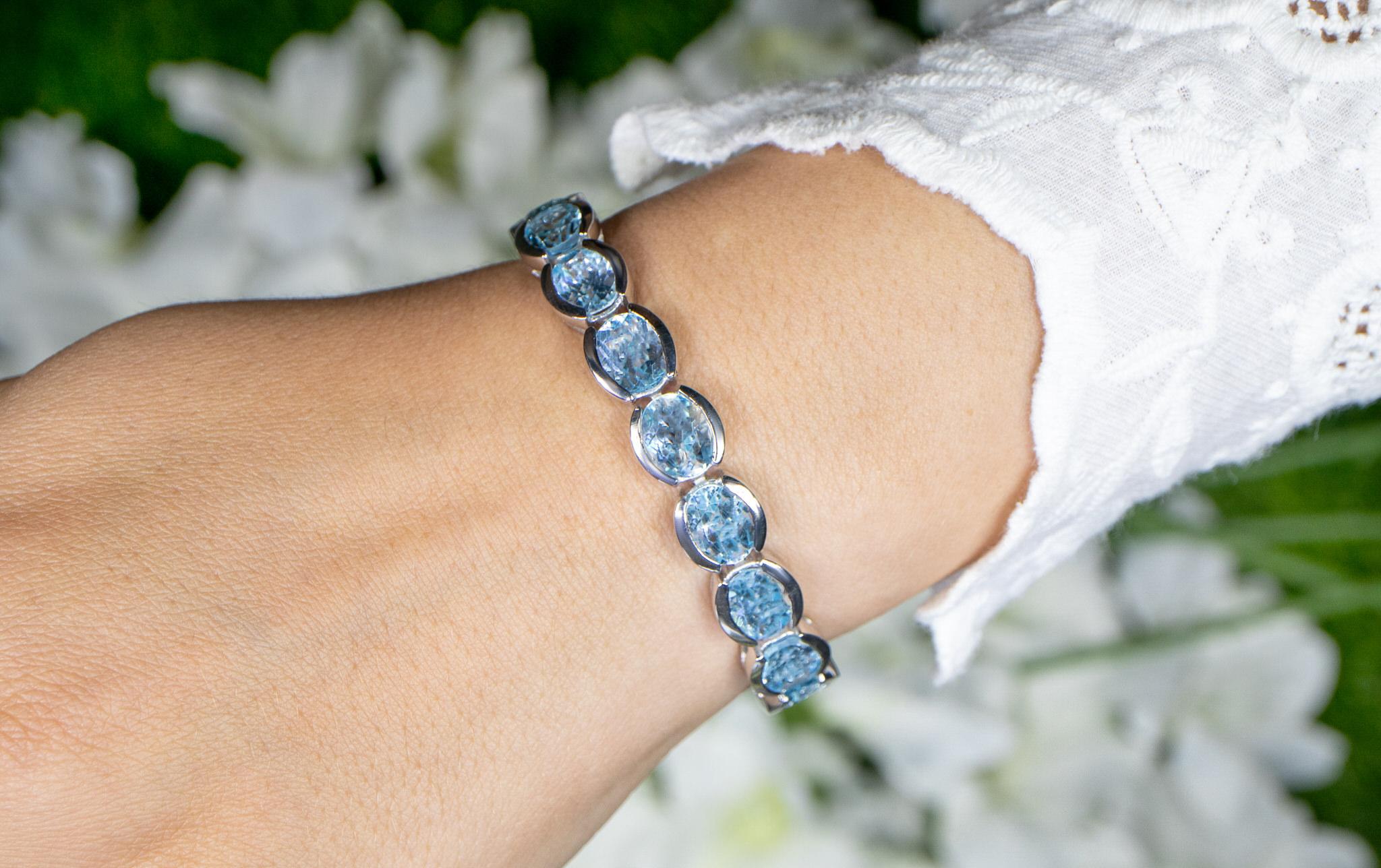 Oval Cut Blue Topaz Tennis Bracelet 43.6 Carats Rhodium Plated Sterling Silver For Sale
