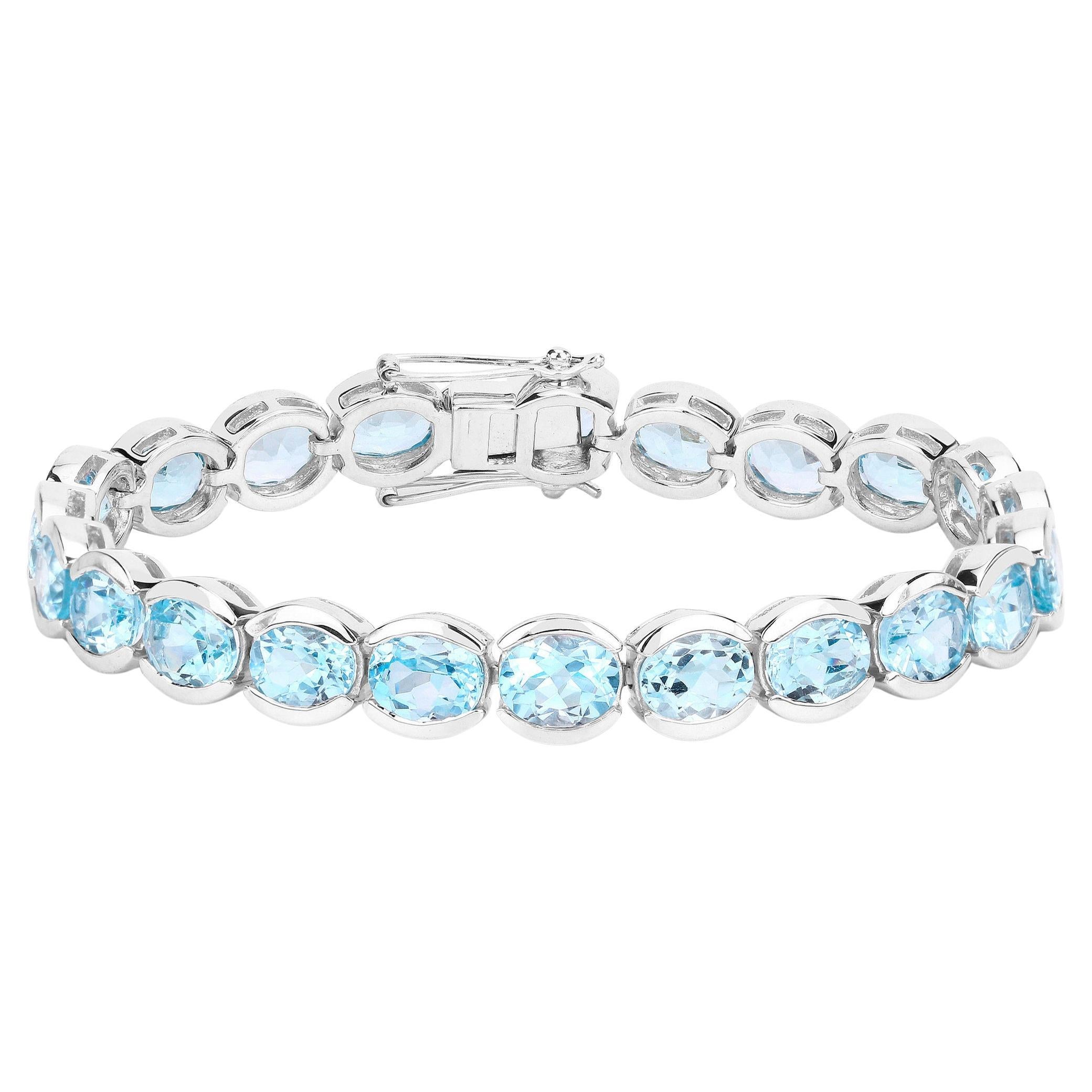 Blaues Topas-Tennisarmband 43.6 Karat rhodiniertes Sterlingsilber
