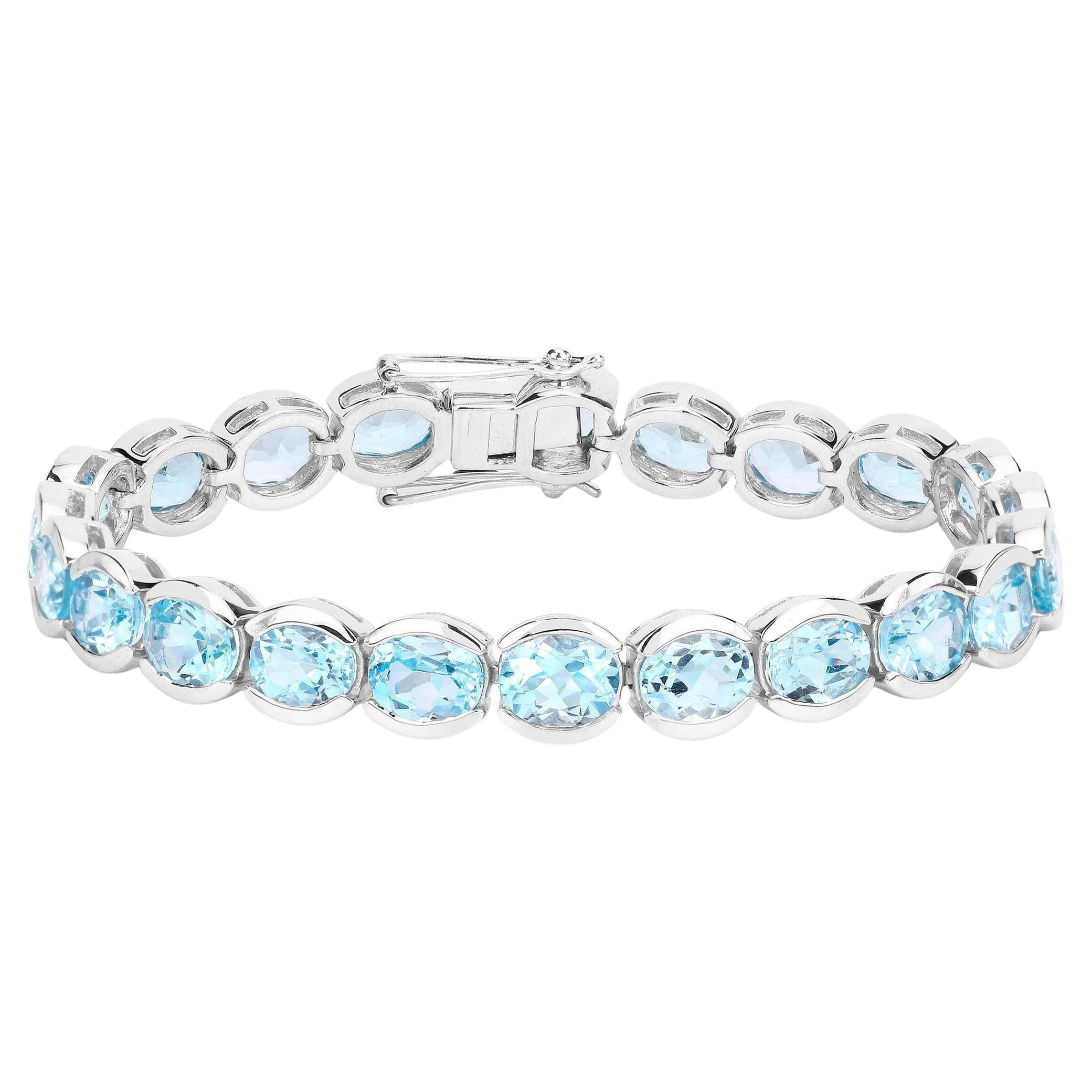 Blue Topaz Tennis Bracelet 43.6 Carats Rhodium Plated Sterling Silver For Sale