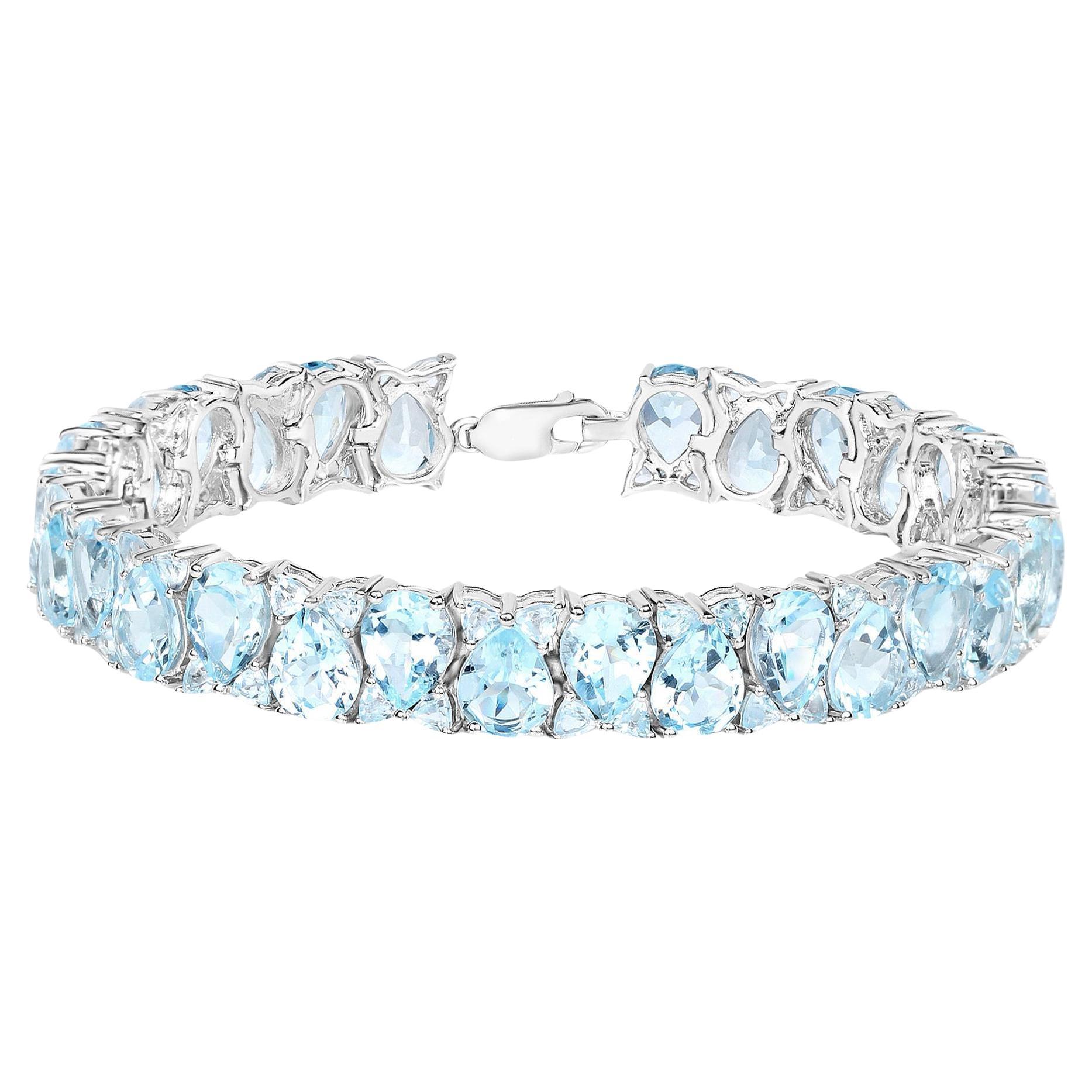 Blue Topaz Tennis Bracelet 58 Carats Rhodium Plated Sterling Silver For Sale
