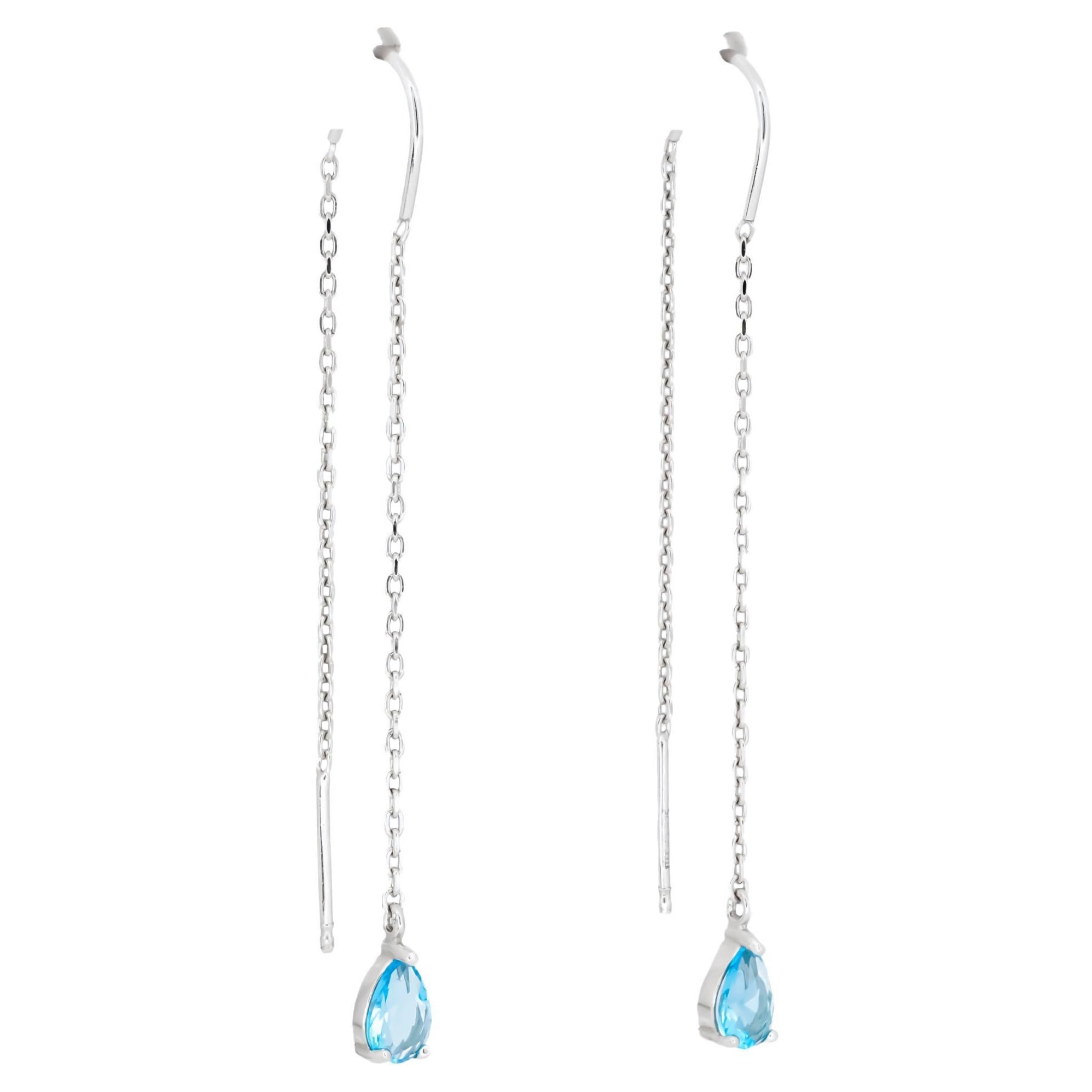 Boucles d'oreilles enfilées en or 14k avec topaze bleue en vente