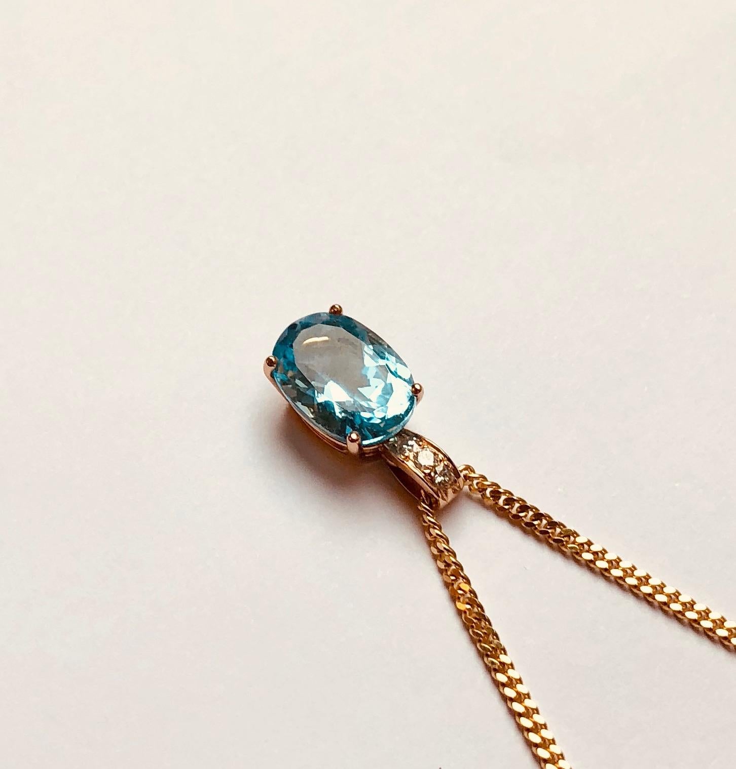 This pendant features an exquisite oval shaped blue topaz. This pendant was designed and made by Van der Veken, an Antwerp, Belgium-based High Jewelry house founded in 1952.

Each jewel is unique, crafted entirely by hand and comes with a lifetime