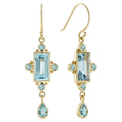 Orecchini a goccia in stile vintage con topazio blu e oro giallo 14 carati