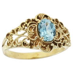 Anello in filigrana stile vintage con topazio blu e oro giallo massiccio 9 carati