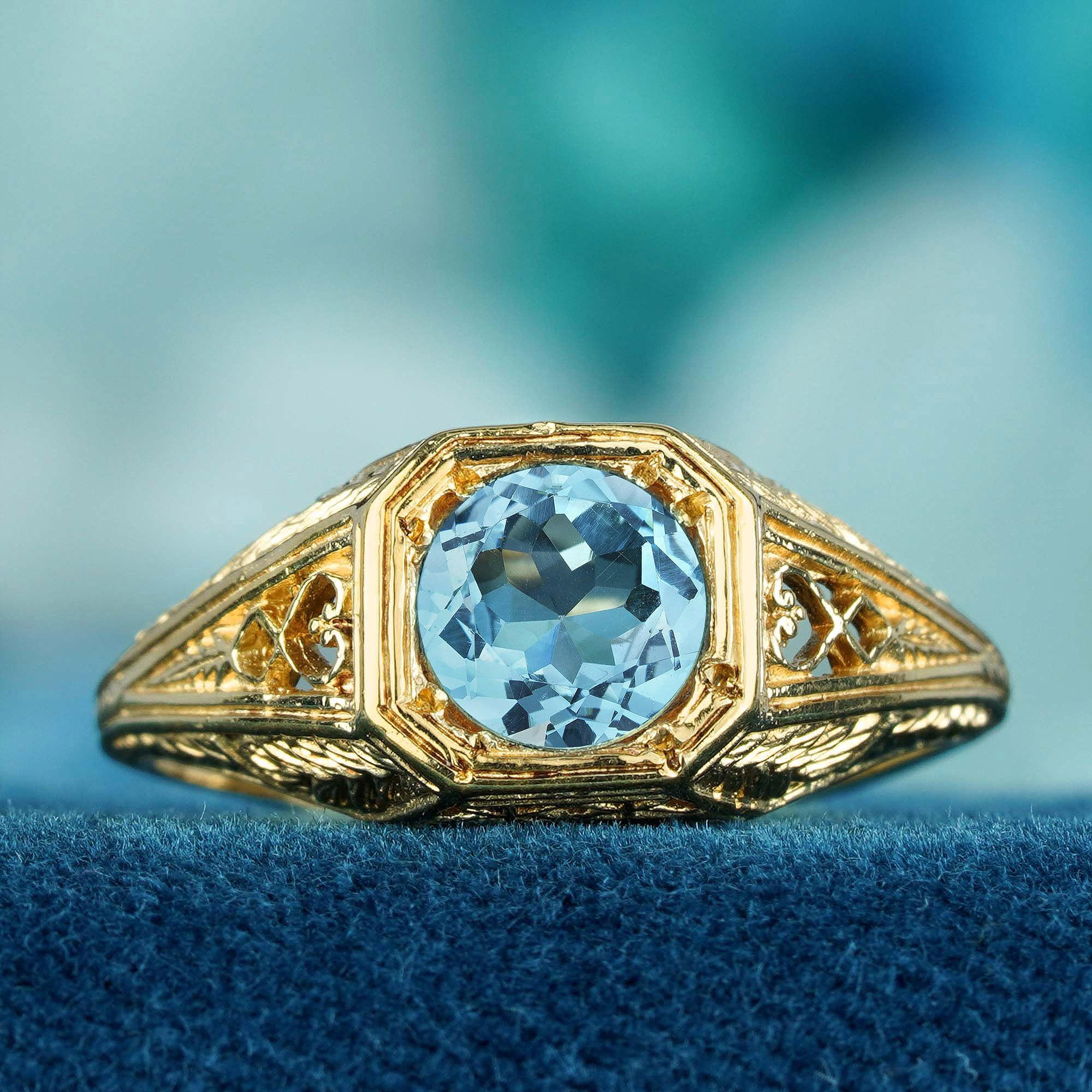 Radiate elegance and sophistication with our Natural Blue Topaz Vintage Style Filigree Ring, expertly crafted in Solid 9K Yellow Gold. 
This stunning ring features a vibrant blue topaz at its center. The vintage-inspired design, with its intricate