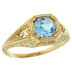 Bague halo vintage en or jaune 9 carats massif avec topaze bleue