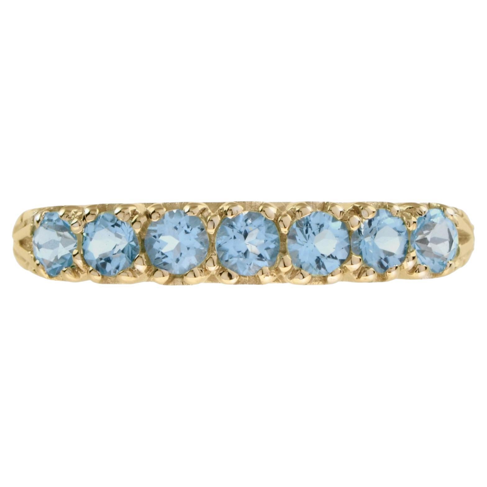 Anillo de oro amarillo de 14 quilates con siete piedras de topacio azul estilo vintage