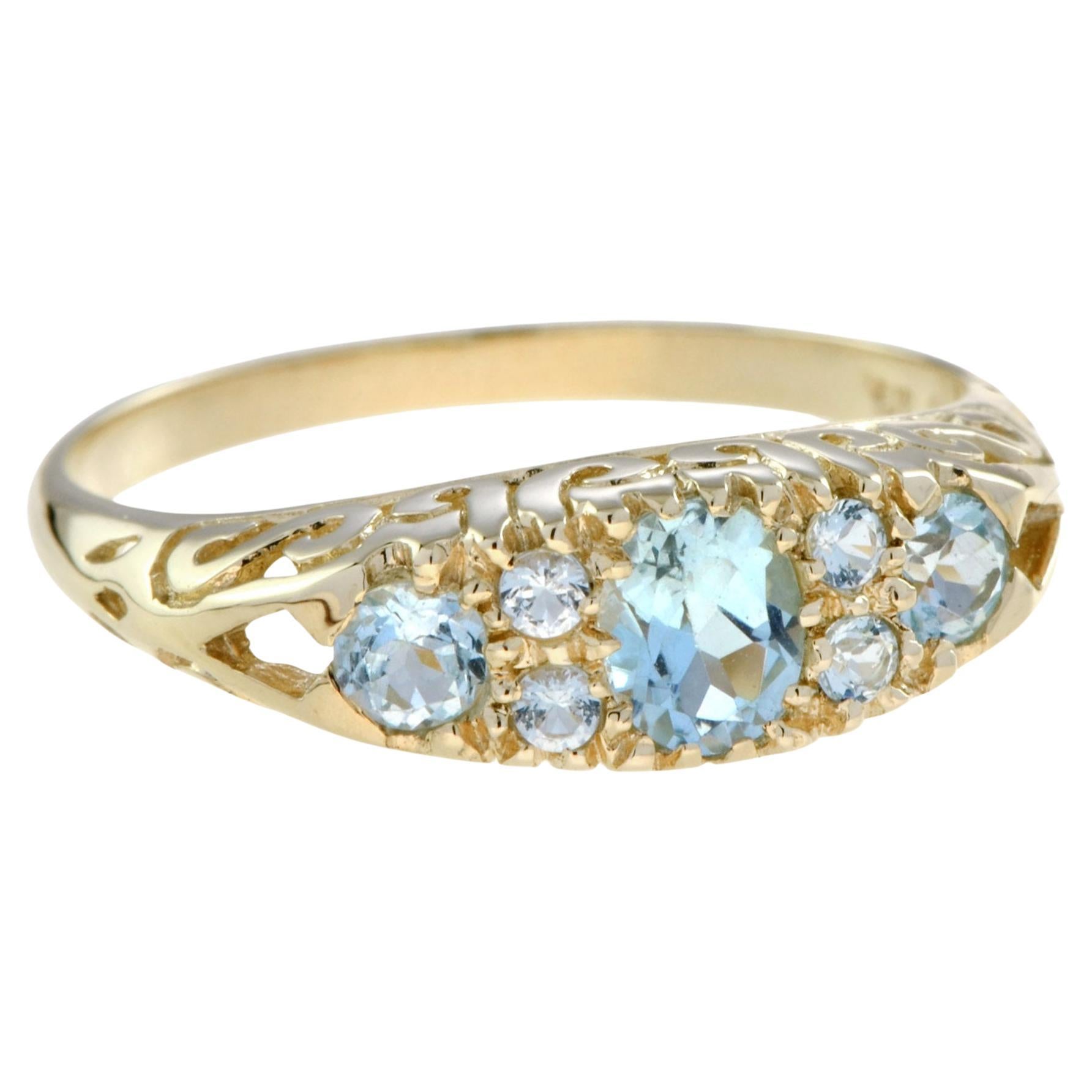 For Sale:  Blue Topaz Vintage Style Three Stone Filigree Ring in 14K Yellow Gold